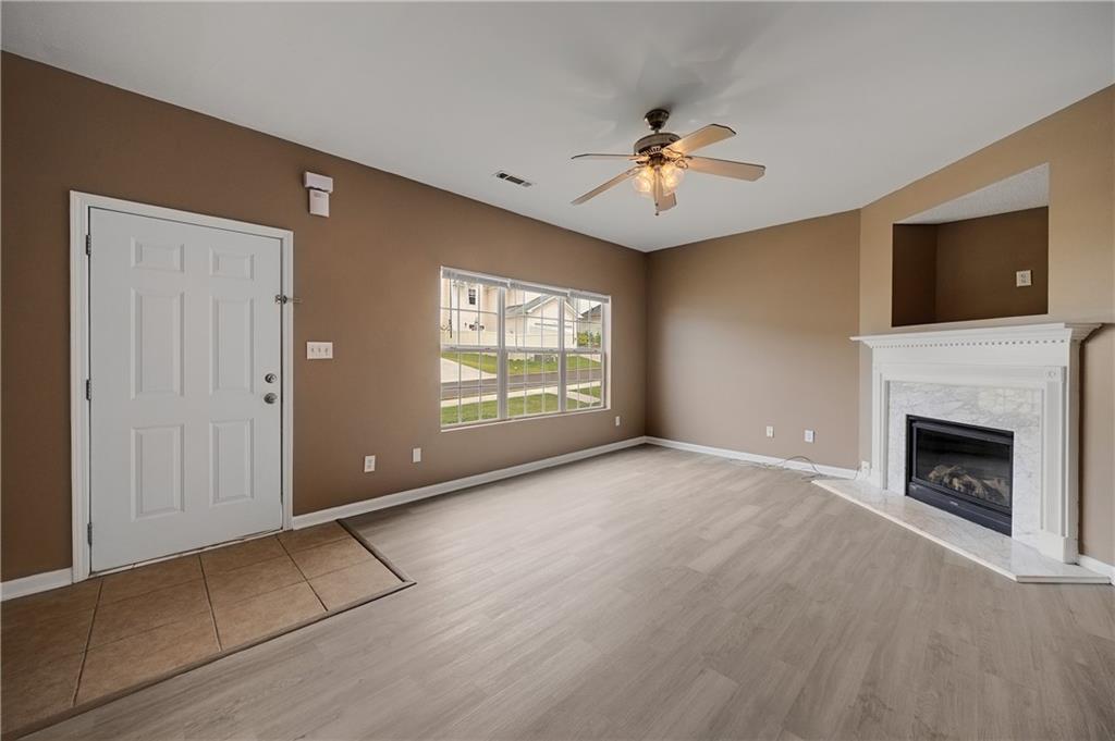 4203 Legacy Square Atlanta, GA 30349 - Photo 9 of 35 a view of an empty room with window and fire place