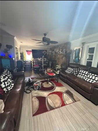 a bedroom with furniture and a wooden floor