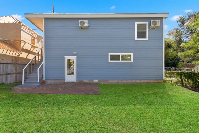 a brick house with a yard