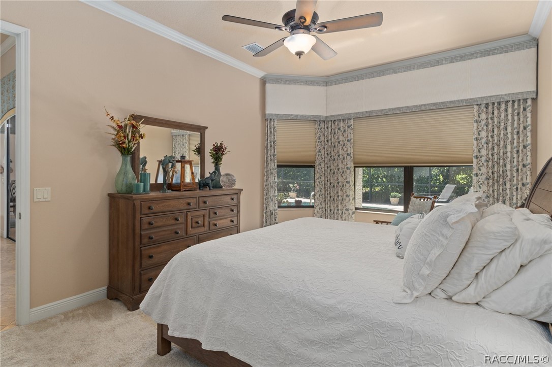 2015 North Rhodes Point Hernando, FL 34442 - Photo 19 of 82 The Primary Bedroom's decor is finished with Crown Molding, pleated shades that can be opened at the top and bottom.