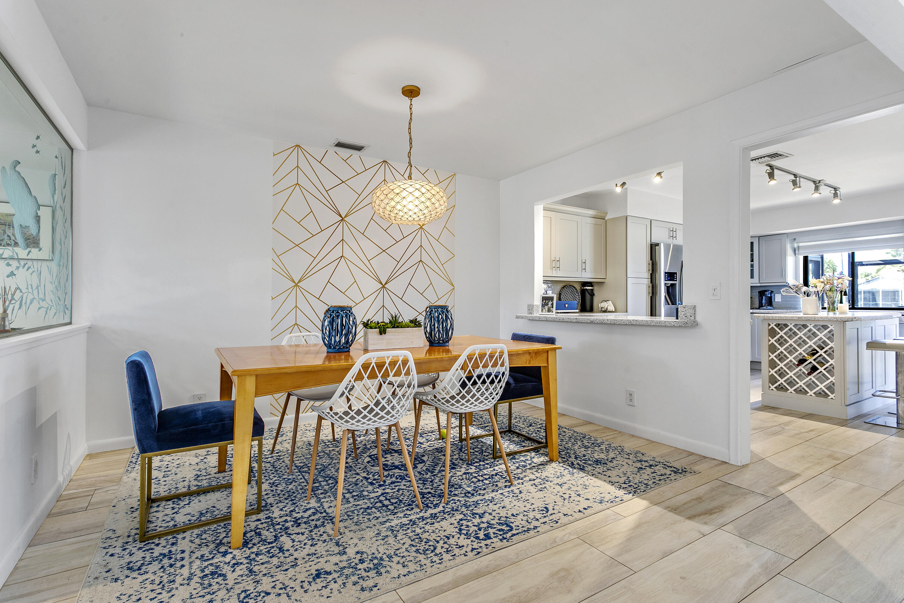 3697 Cape Pointe Circle Jupiter, FL 33477 - Photo 11 of 55 a dining room with furniture and wooden floor