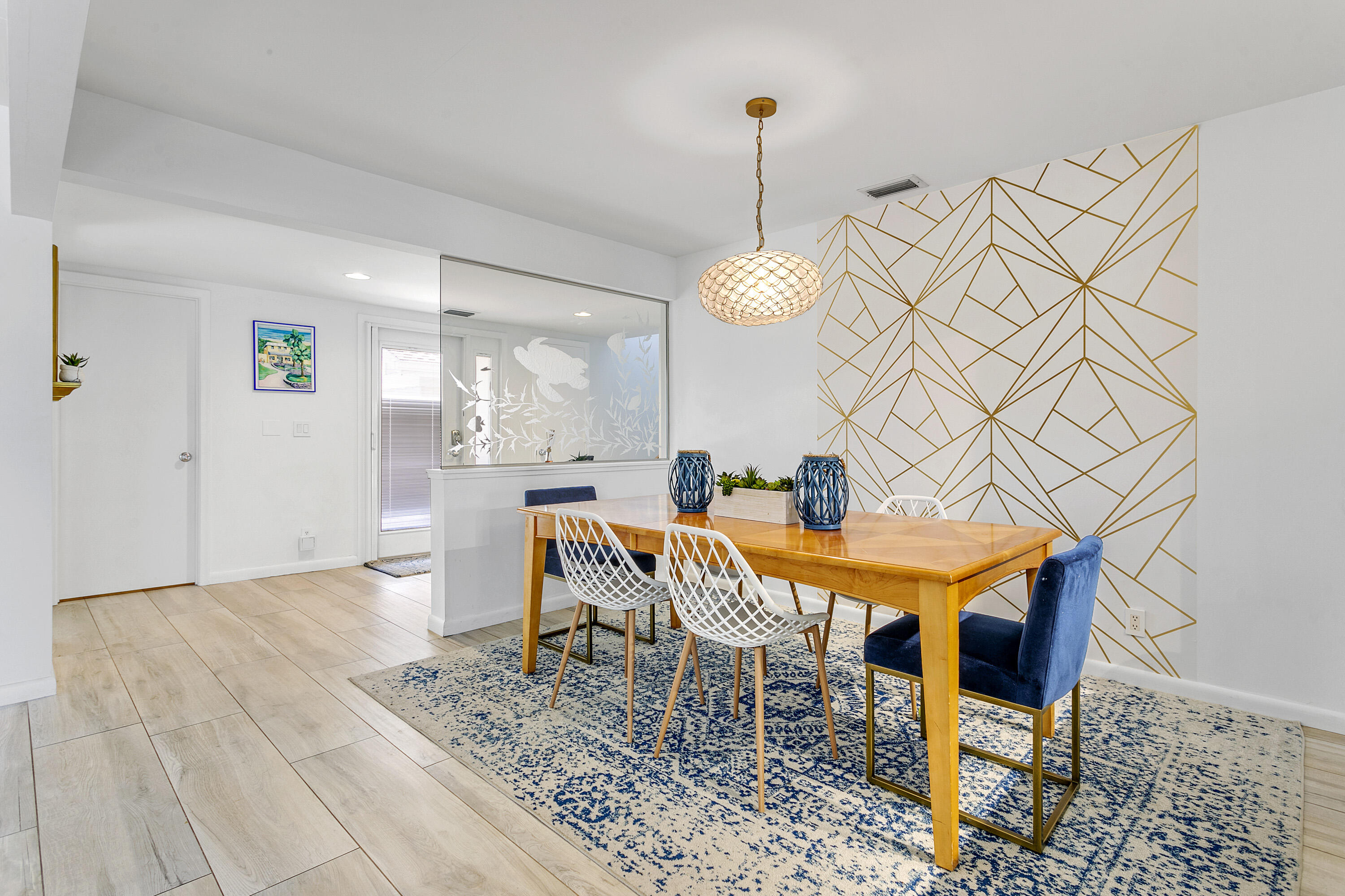 3697 Cape Pointe Circle Jupiter, FL 33477 - Photo 12 of 55 a dining room with a table and chairs