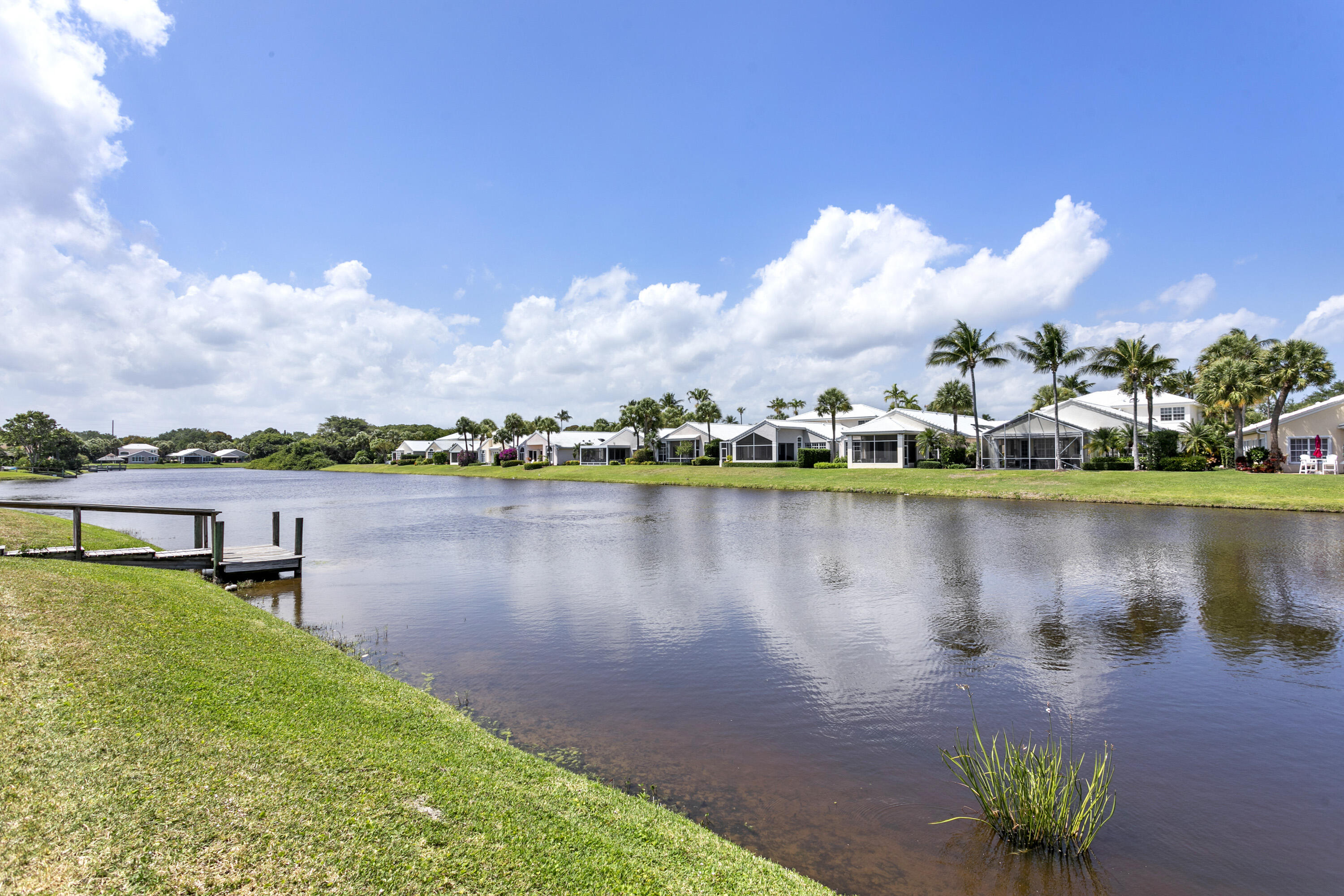 3697 Cape Pointe Circle Jupiter, FL 33477 - Photo 15 of 55 a view of a lake with houses in the back