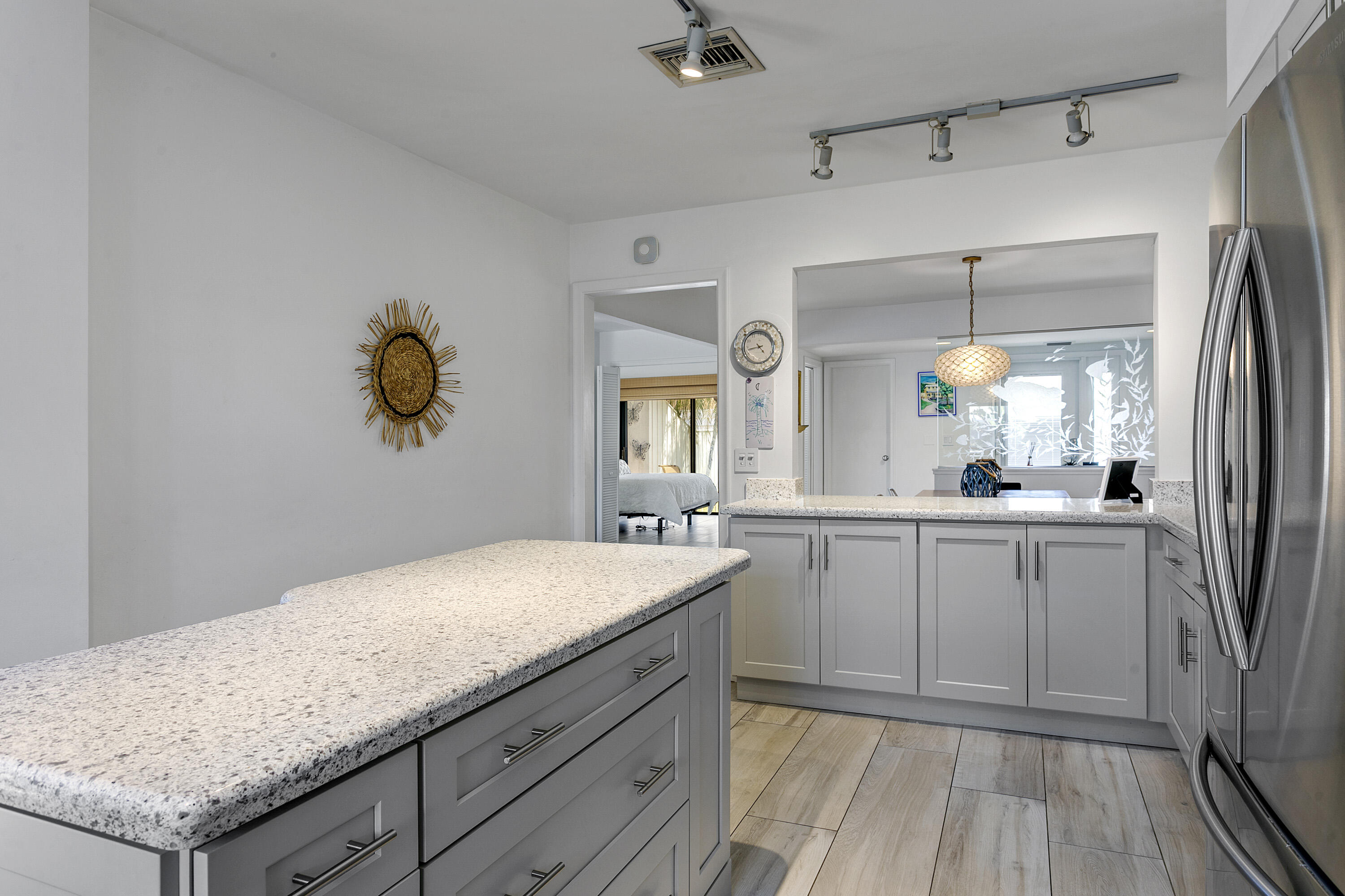 3697 Cape Pointe Circle Jupiter, FL 33477 - Photo 17 of 55 a bathroom with a granite countertop sink a vanity and mirror