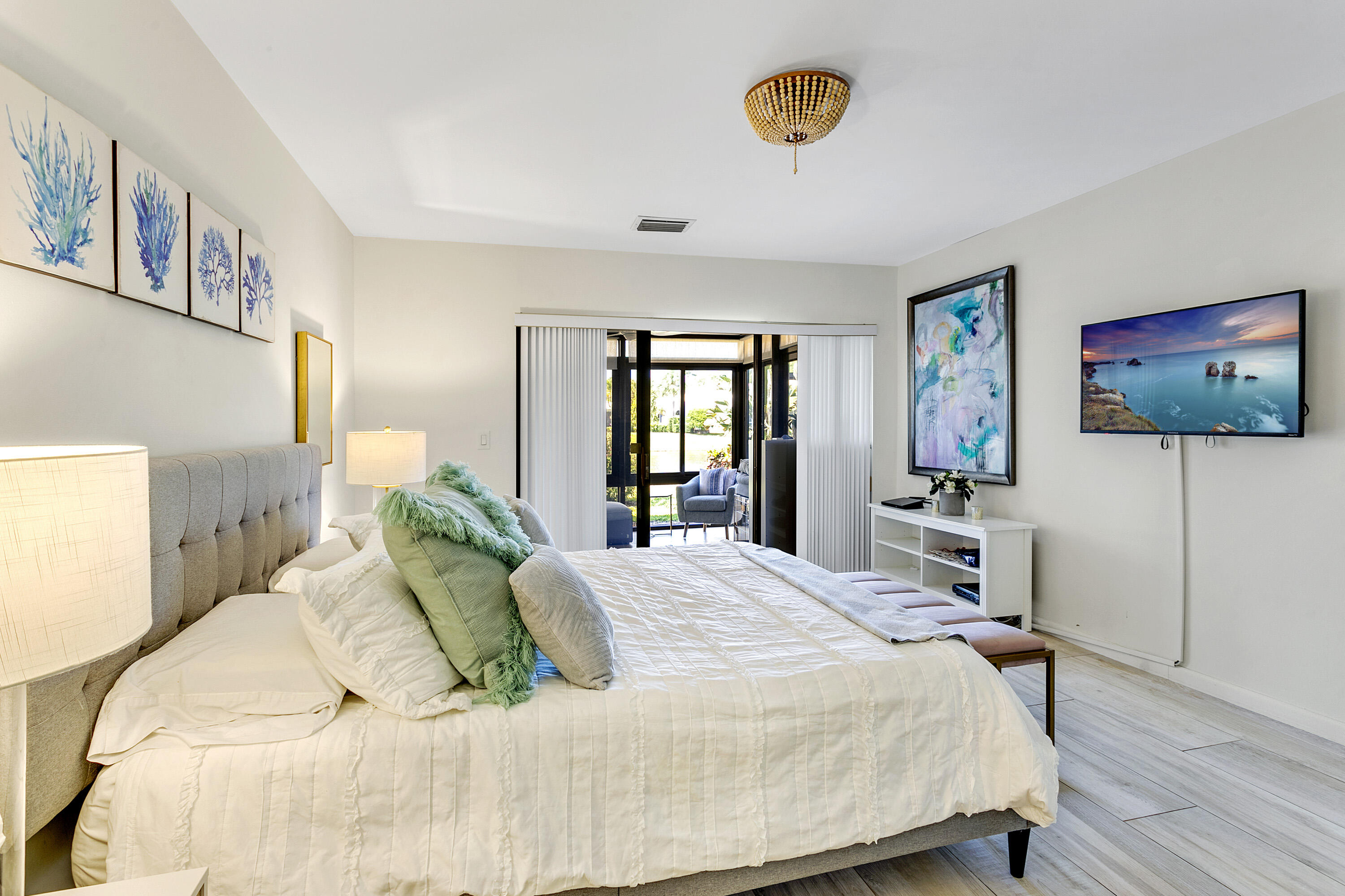 3697 Cape Pointe Circle Jupiter, FL 33477 - Photo 20 of 55 a bedroom with a bed and a flat screen tv