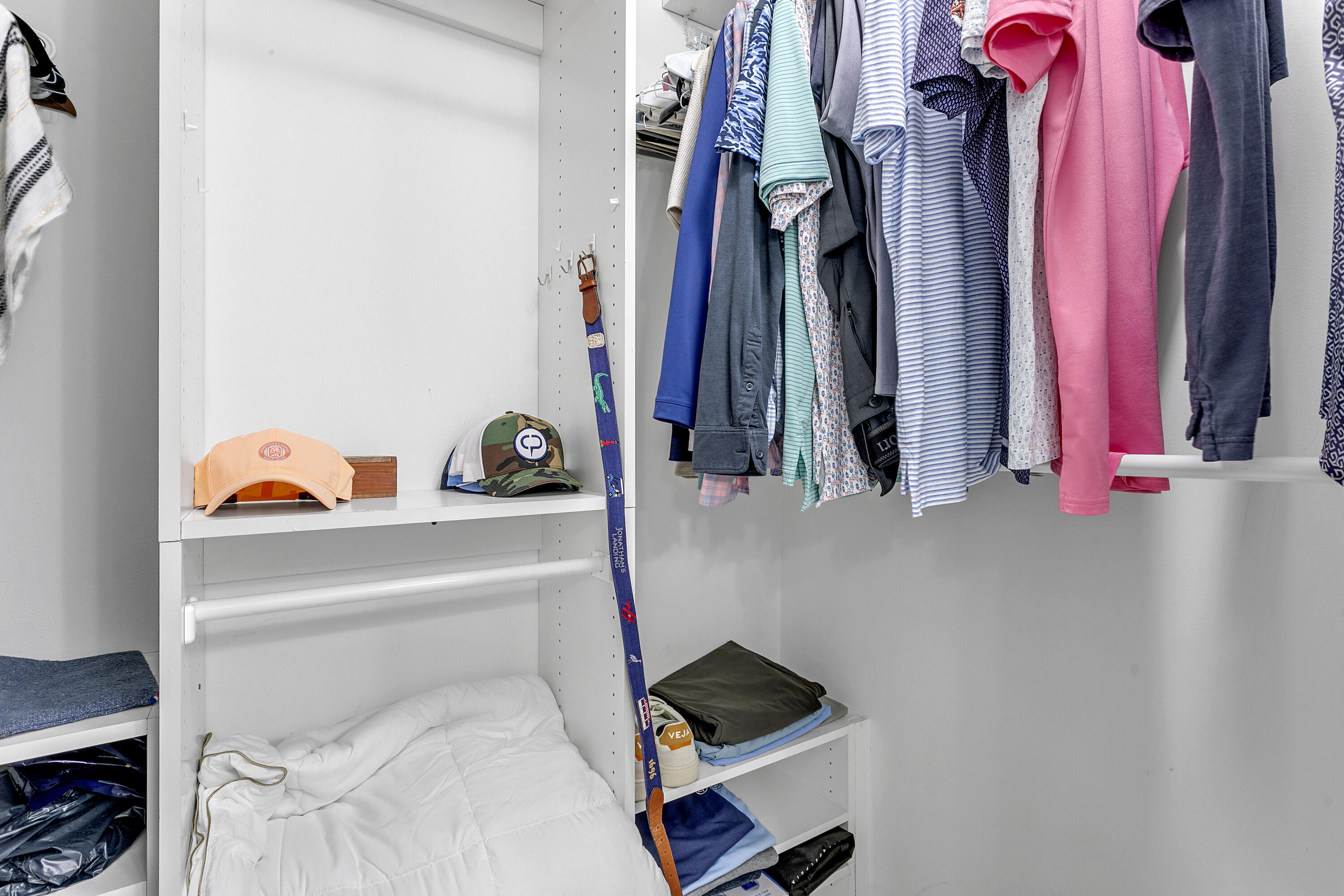 3697 Cape Pointe Circle Jupiter, FL 33477 - Photo 24 of 55 a view of walk in closet with clothes and shoes