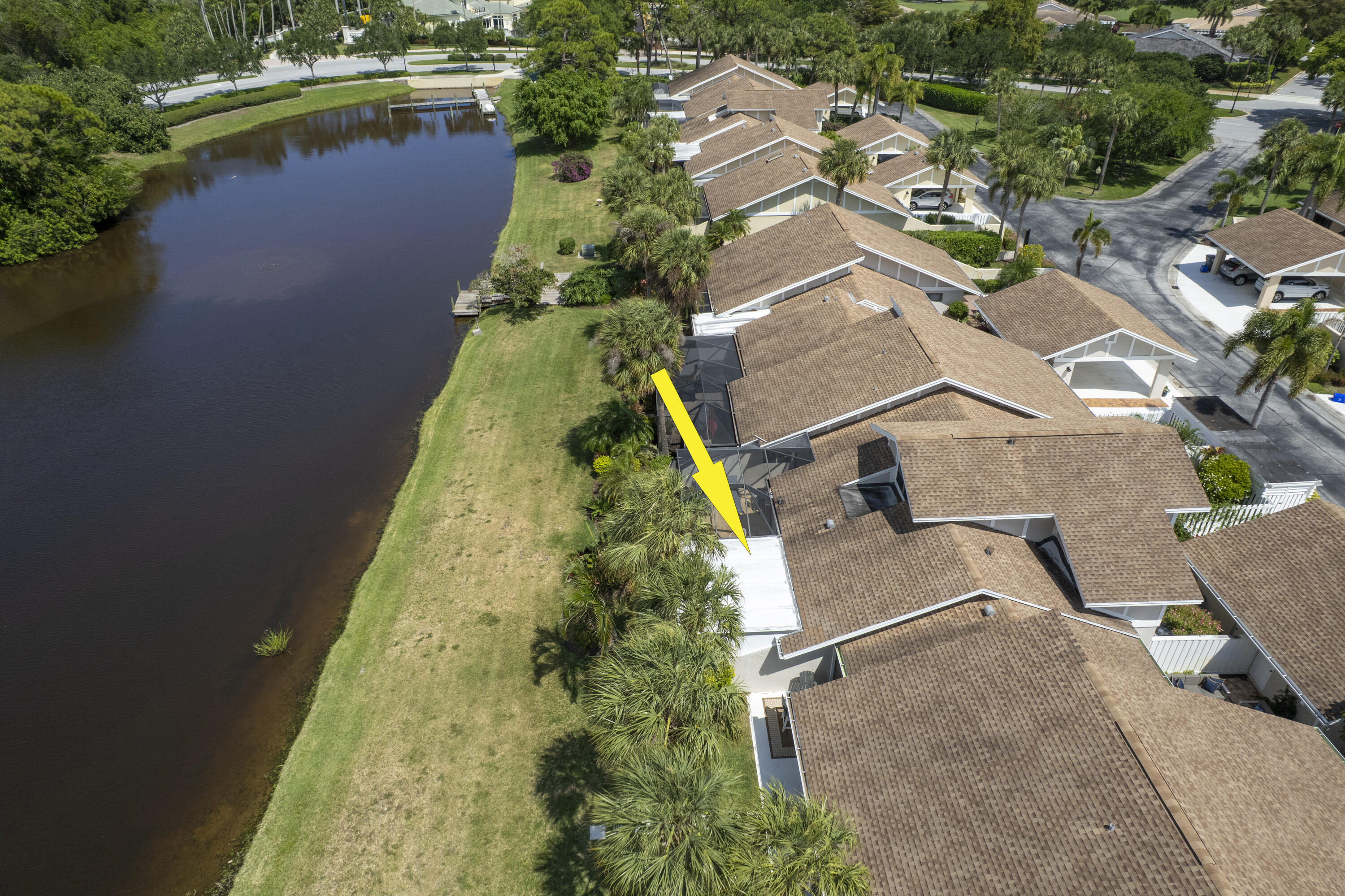 3697 Cape Pointe Circle Jupiter, FL 33477 - Photo 3 of 55 an aerial view of a house with a yard and lake view