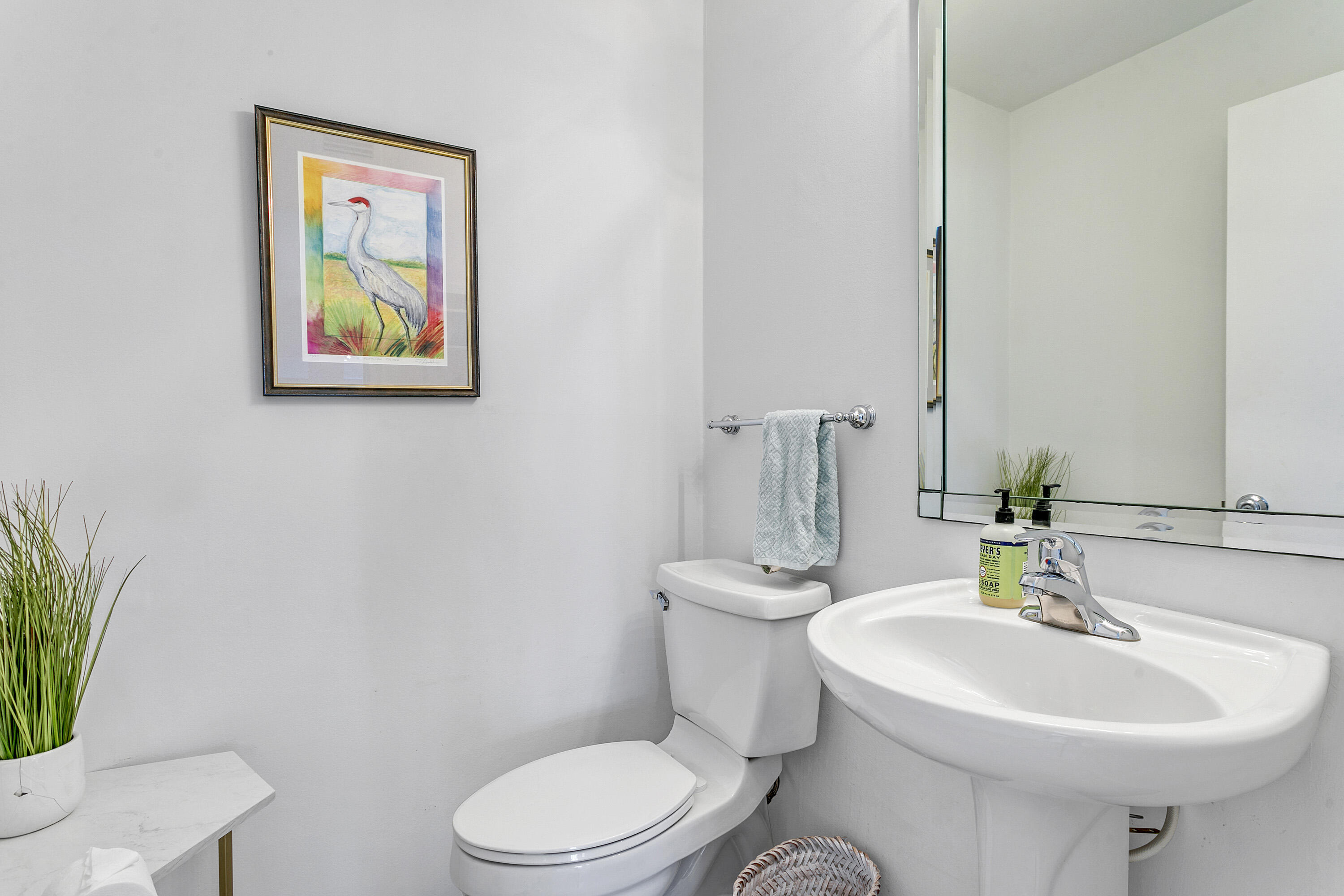 3697 Cape Pointe Circle Jupiter, FL 33477 - Photo 32 of 55 a bathroom with a toilet a sink and a mirror