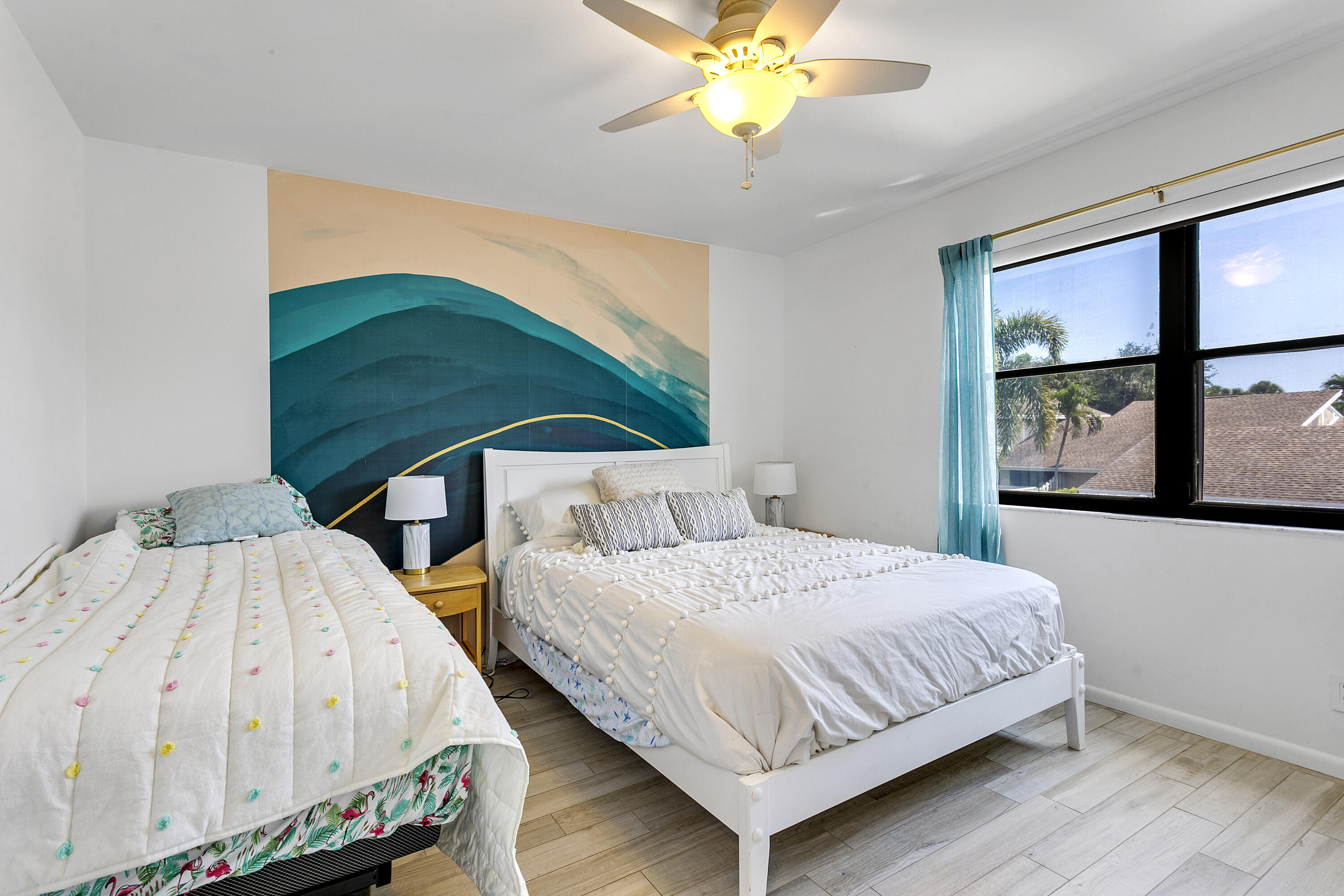 3697 Cape Pointe Circle Jupiter, FL 33477 - Photo 34 of 55 a bedroom with 2 bed and a window