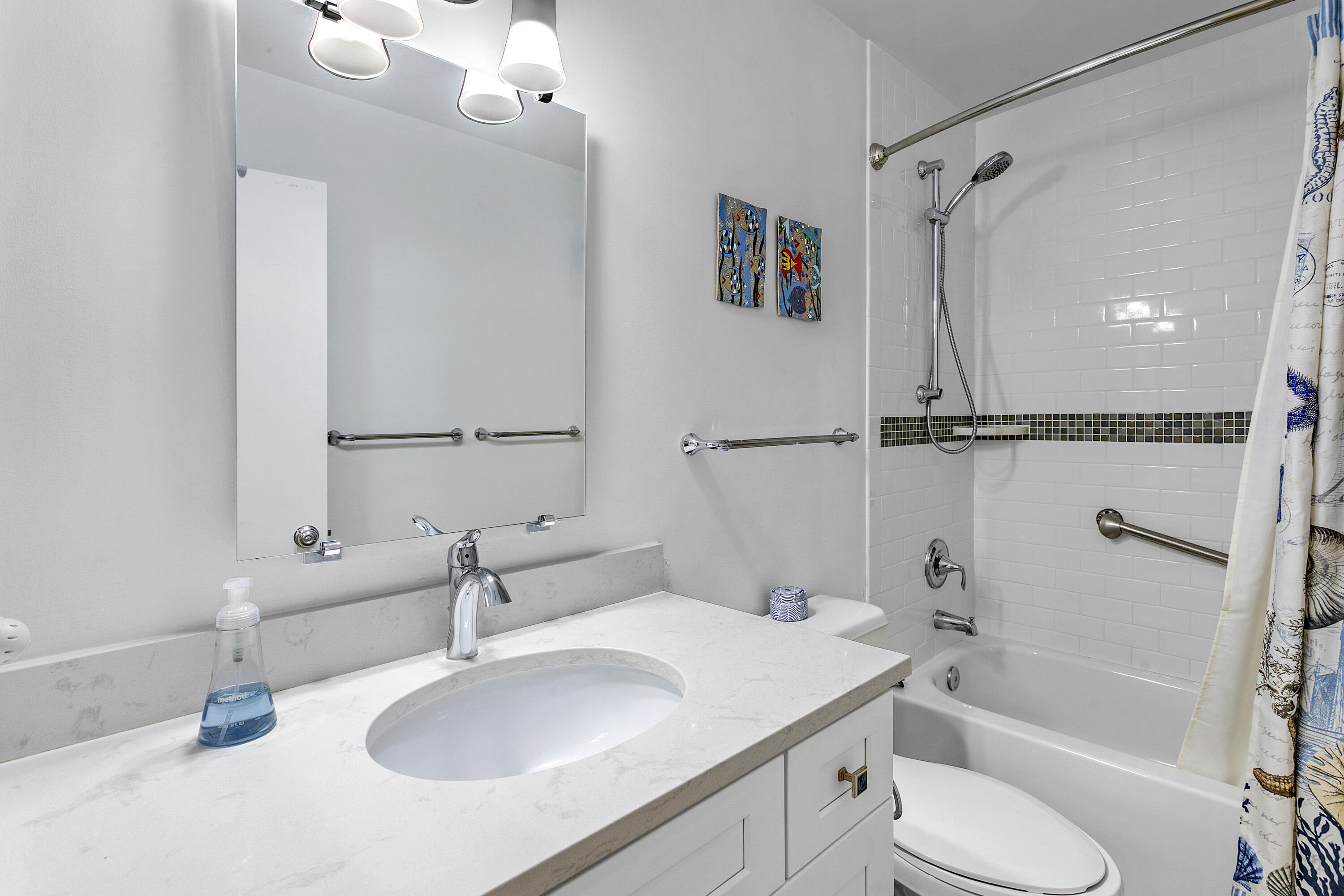 3697 Cape Pointe Circle Jupiter, FL 33477 - Photo 35 of 55 a bathroom with a sink toilet tub and shower