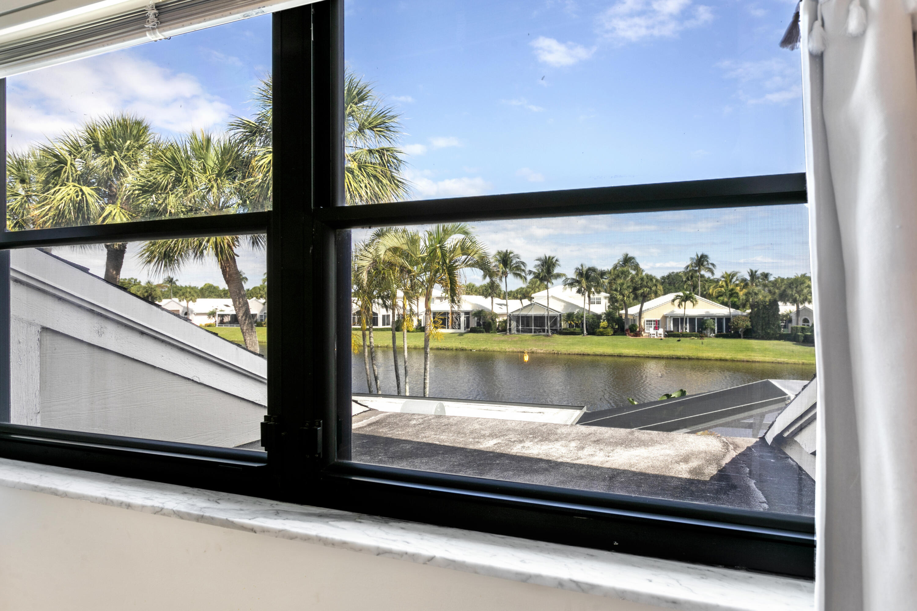 3697 Cape Pointe Circle Jupiter, FL 33477 - Photo 36 of 55 a view of lake from window