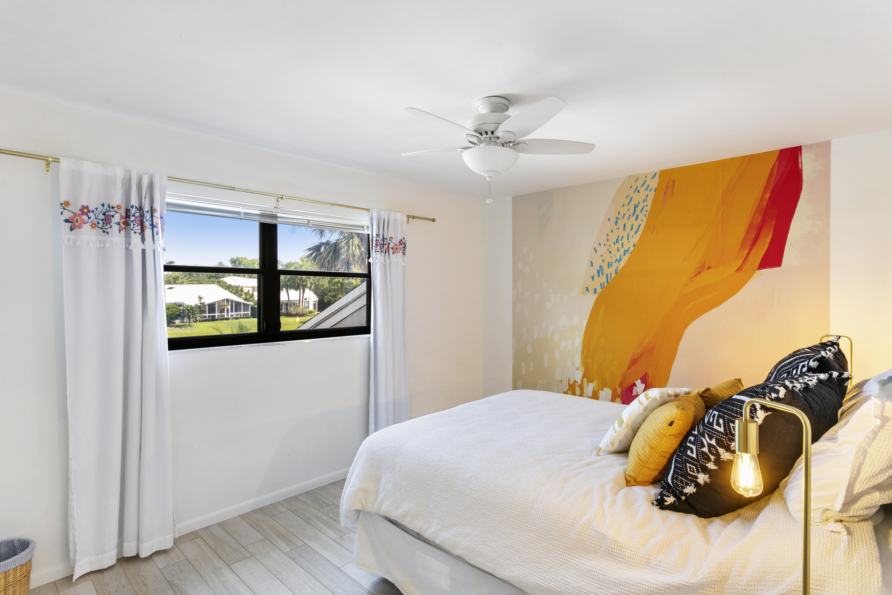 3697 Cape Pointe Circle Jupiter, FL 33477 - Photo 37 of 55 a bedroom with a bed and a painting on the wall