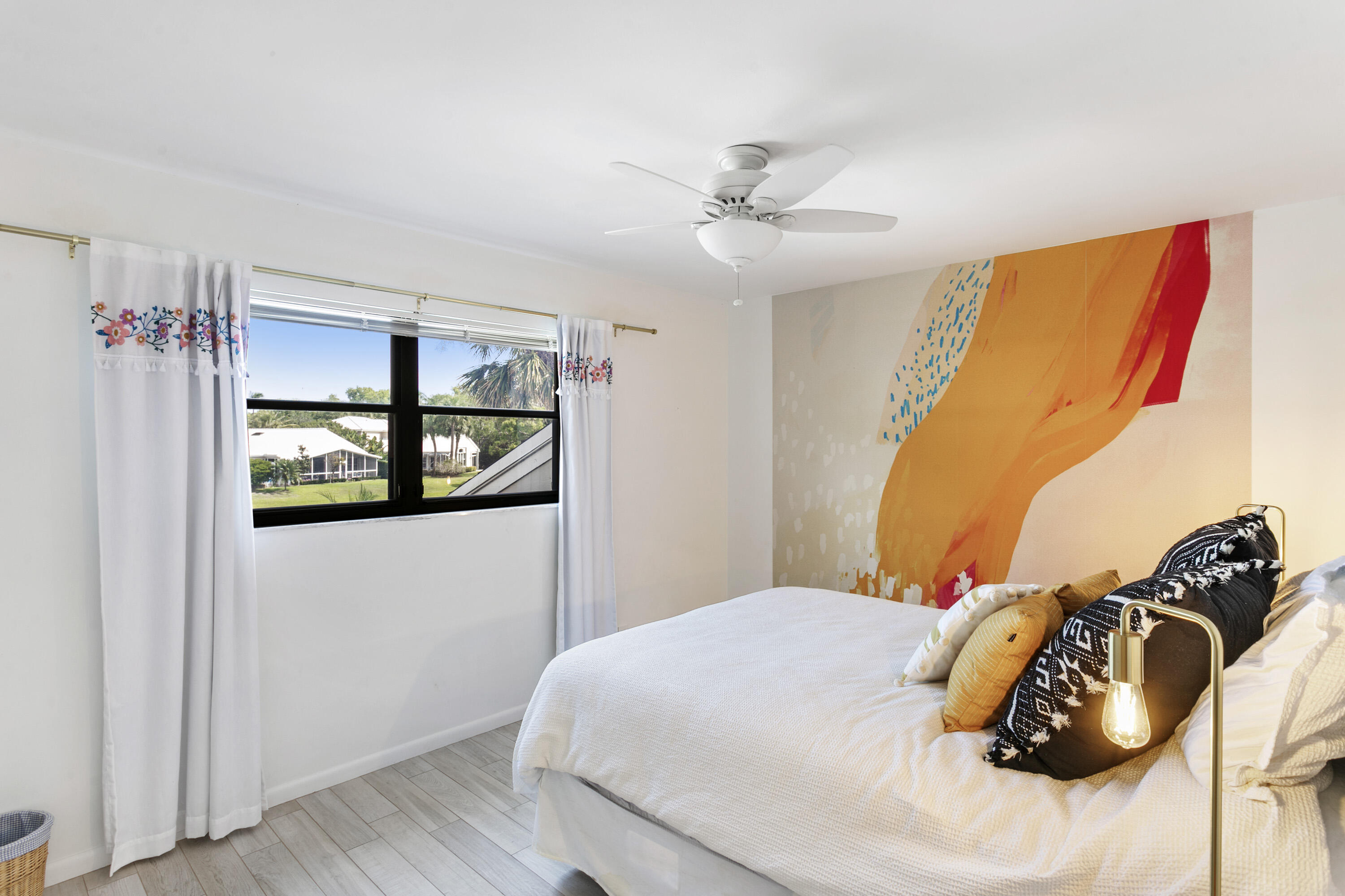 3697 Cape Pointe Circle Jupiter, FL 33477 - Photo 38 of 55 a bedroom with a bed and a window