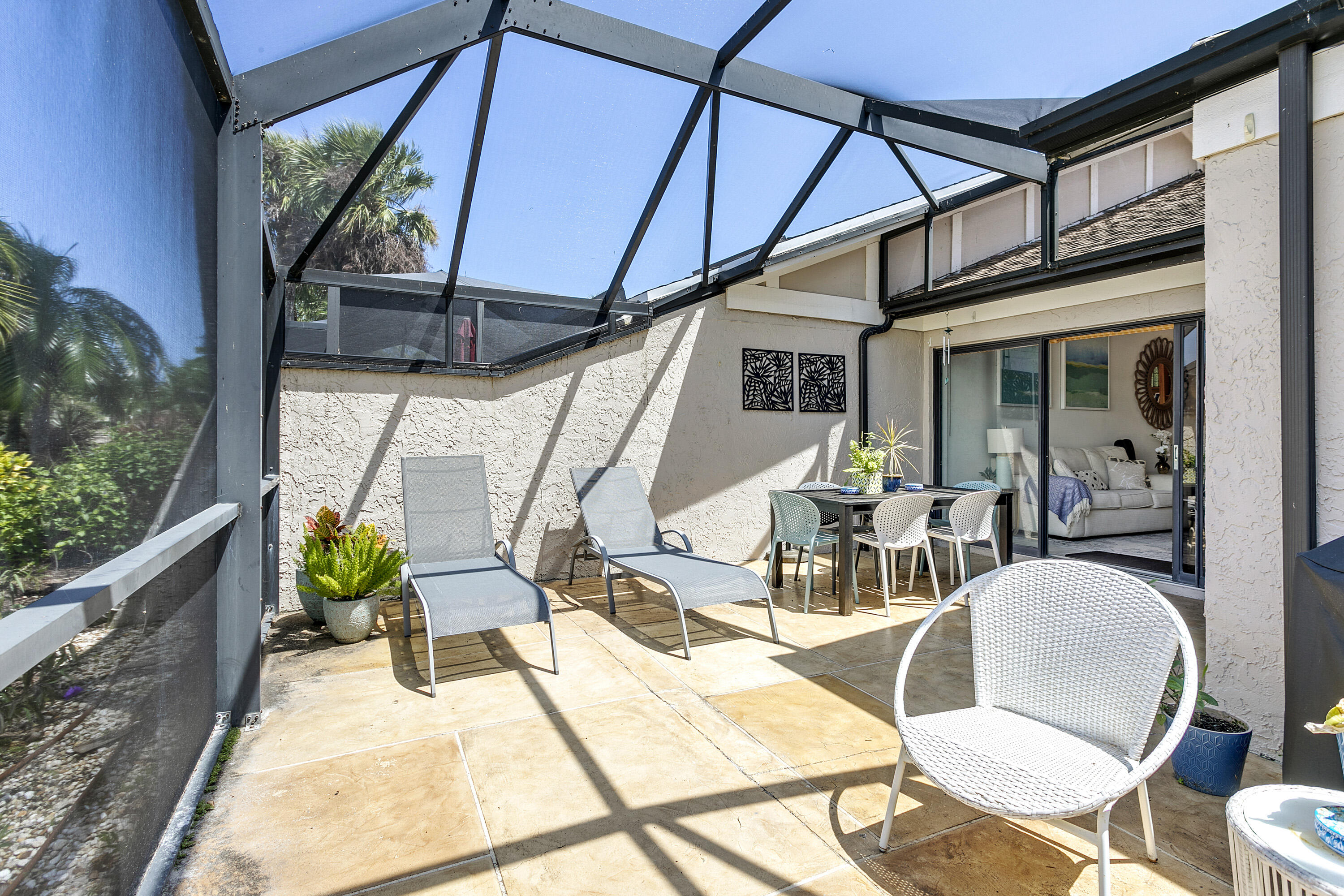3697 Cape Pointe Circle Jupiter, FL 33477 - Photo 41 of 55 a view of a chairs and table in patio