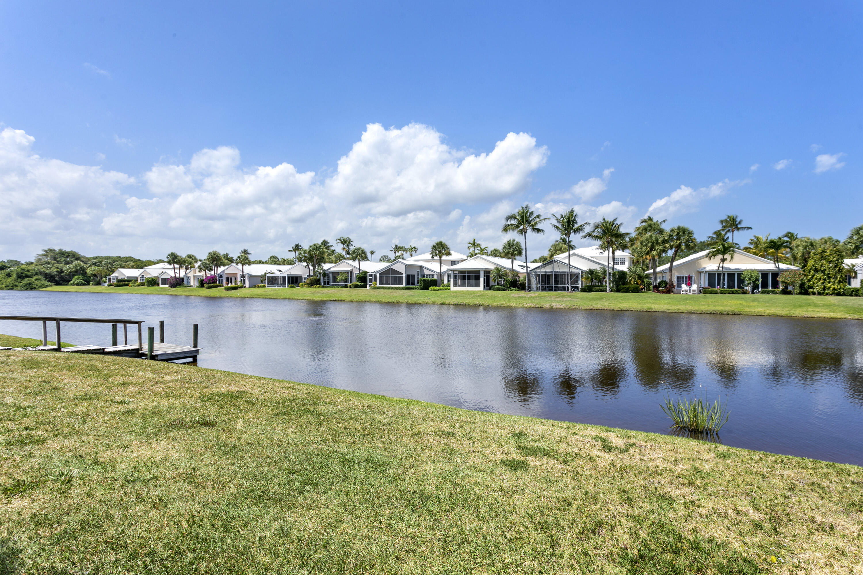 3697 Cape Pointe Circle Jupiter, FL 33477 - Photo 43 of 55 a view of a lake with houses in the back