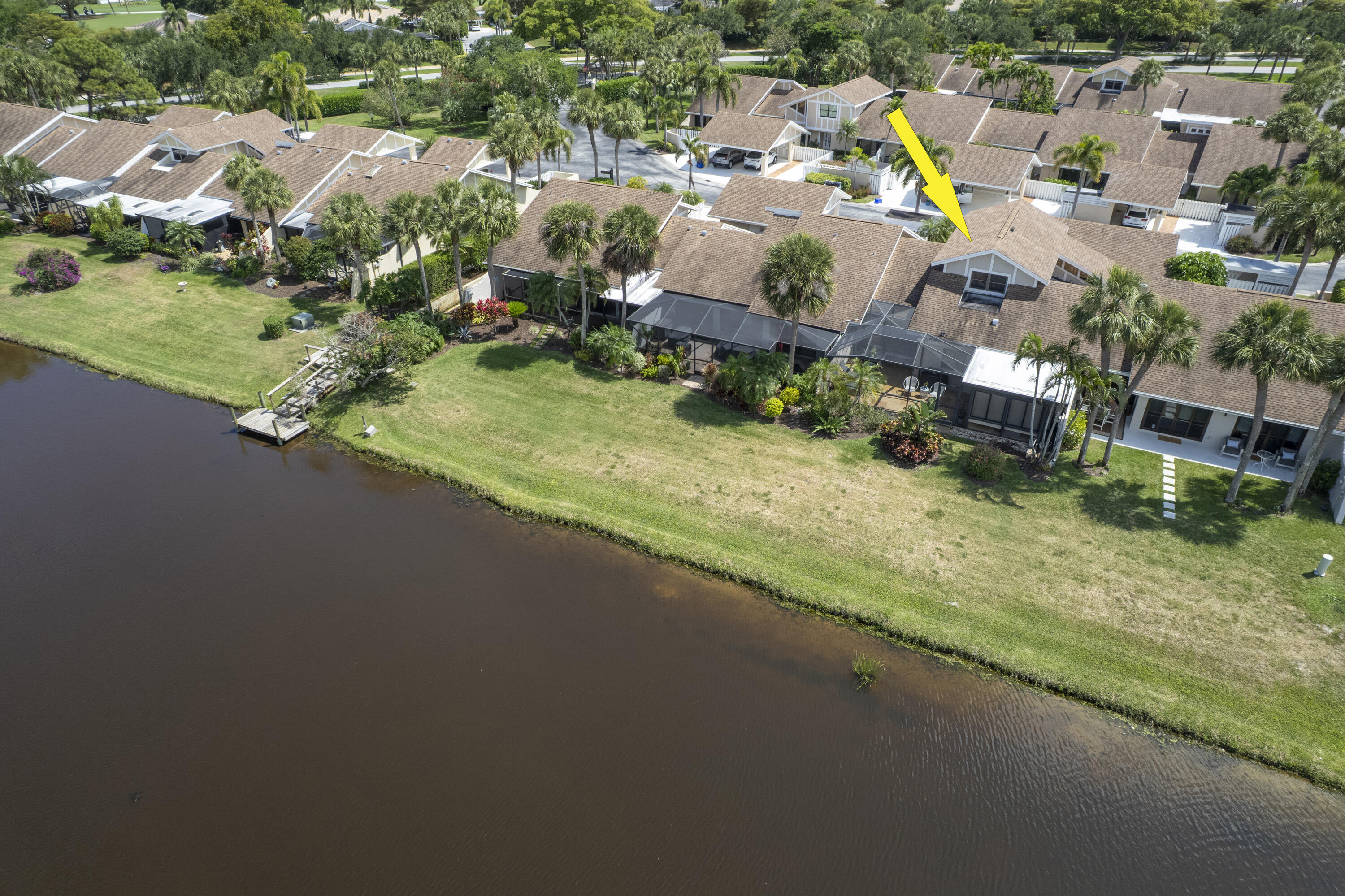 3697 Cape Pointe Circle Jupiter, FL 33477 - Photo 50 of 55 an aerial view of a house with a garden and swimming pool