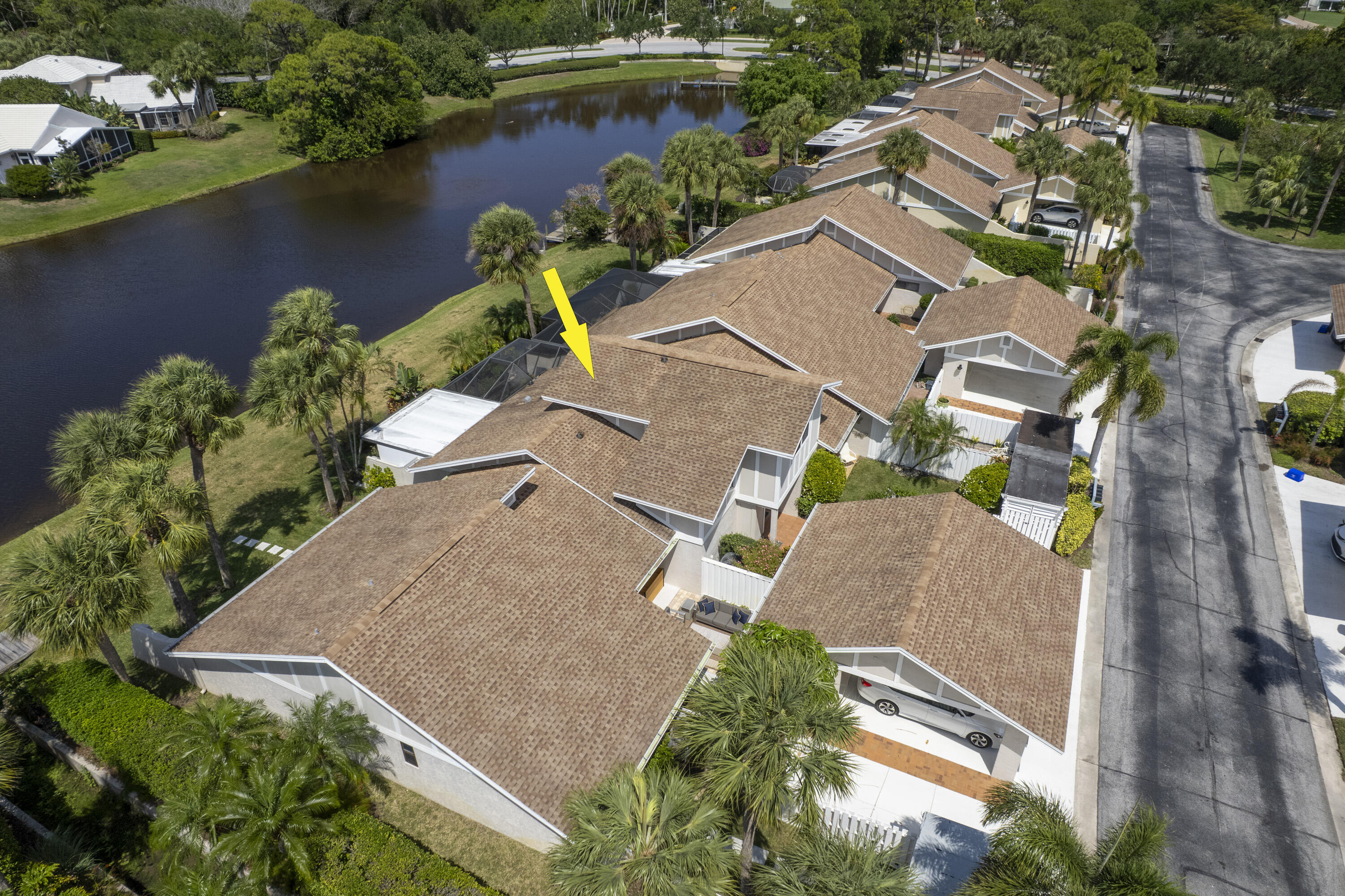 3697 Cape Pointe Circle Jupiter, FL 33477 - Photo 53 of 55 an aerial view of a house with a lake view