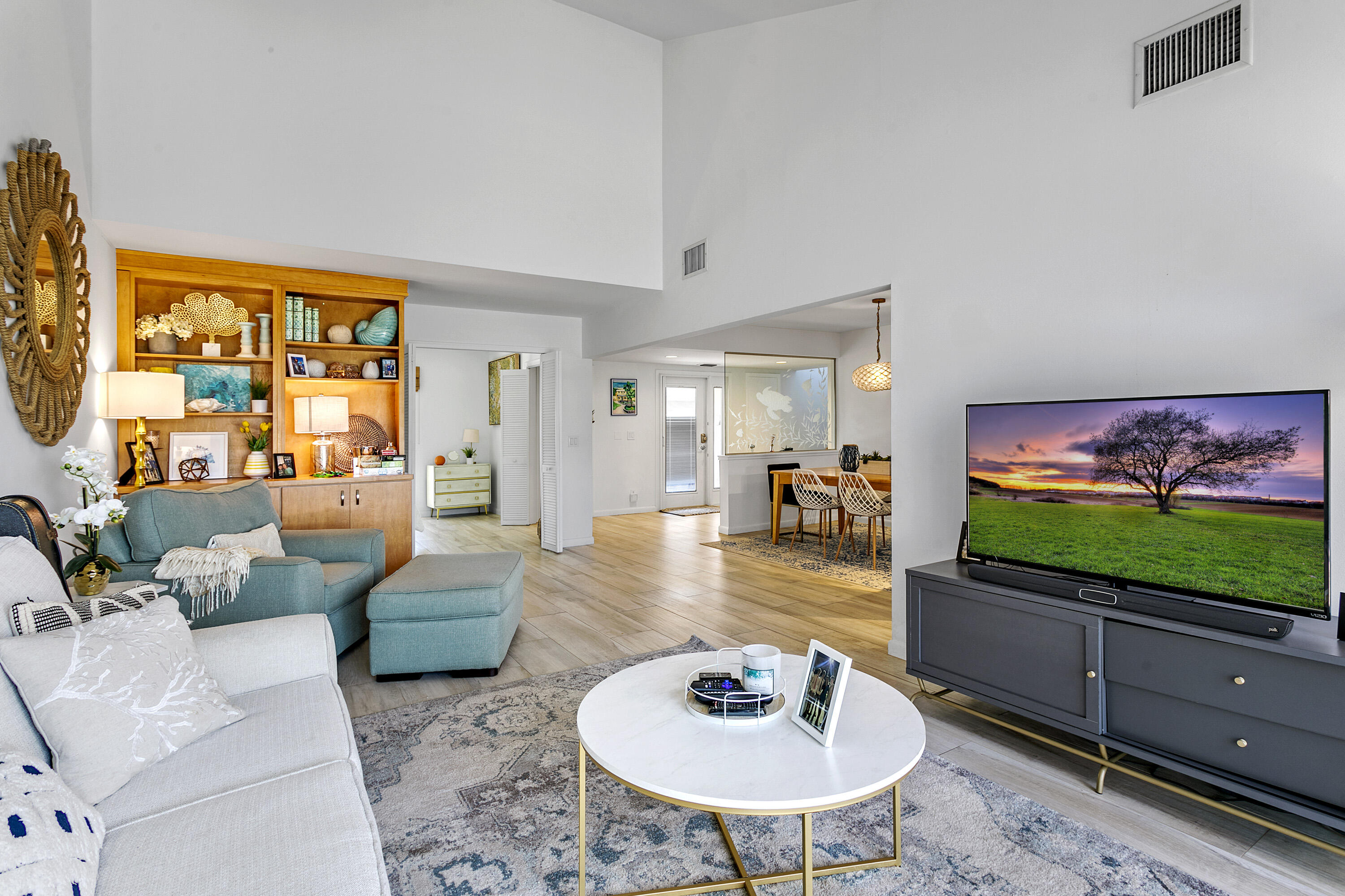 3697 Cape Pointe Circle Jupiter, FL 33477 - Photo 9 of 55 a living room with furniture and a flat screen tv