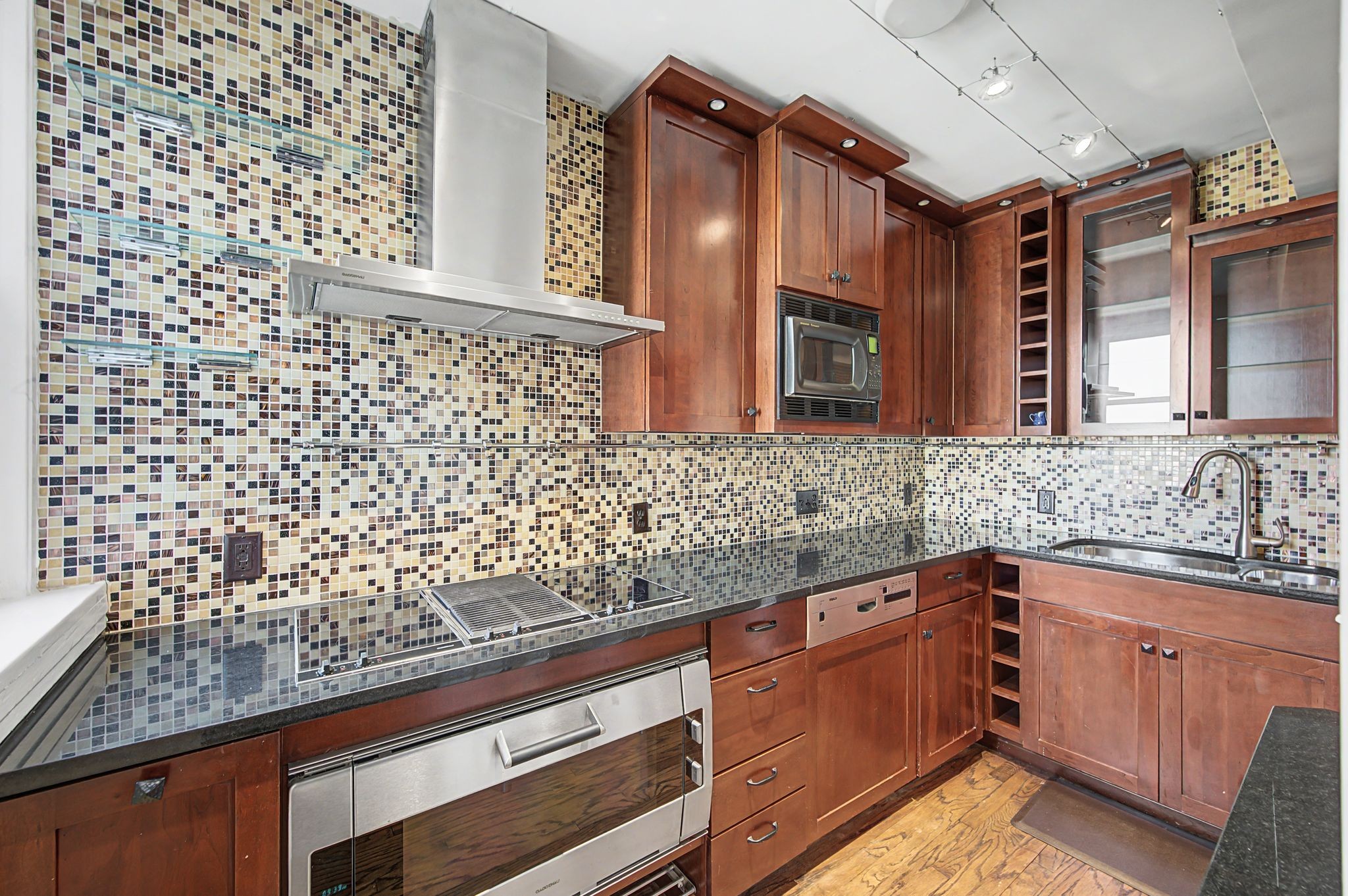 4225 Harding Pike, Unit 603 Nashville, TN 37205 - Photo 22 of 59 a kitchen with granite countertop white cabinets and stainless steel appliances