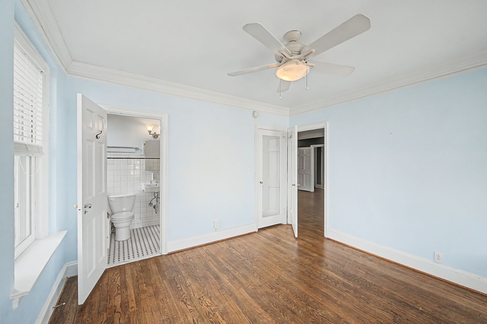 4225 Harding Pike, Unit 603 Nashville, TN 37205 - Photo 30 of 59 a view of a bedroom with wooden floor and a ceiling fan
