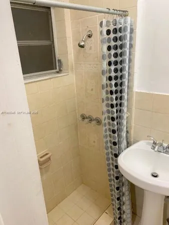 a bathroom with a sink and mirror