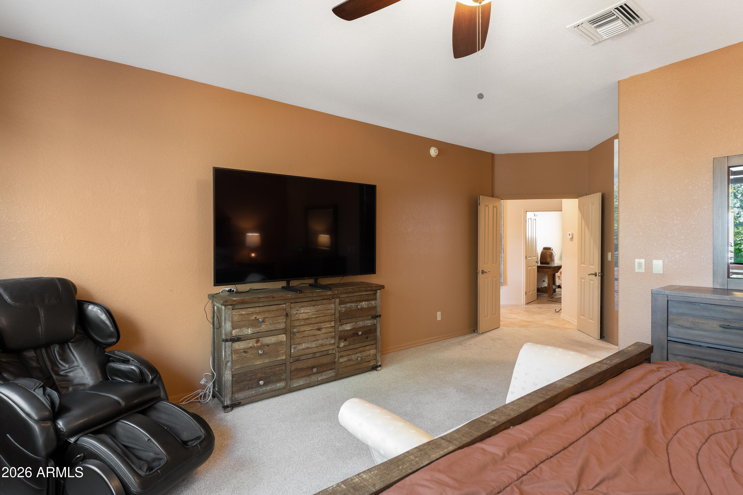 18622 North Tonto Verde Drive Rio Verde, AZ 85263 - Photo 21 of 47 a living room with furniture and a flat screen tv