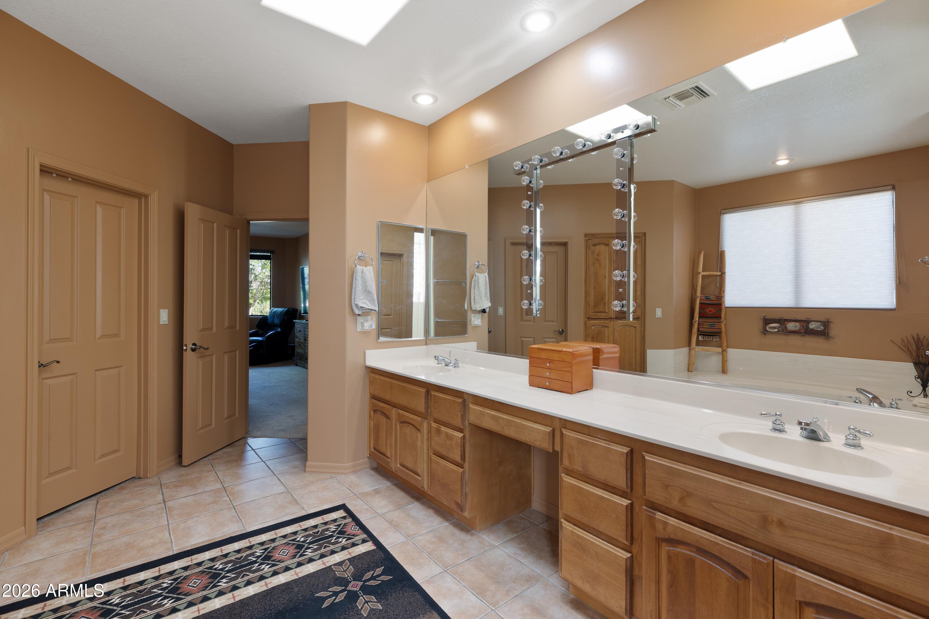 18622 North Tonto Verde Drive Rio Verde, AZ 85263 - Photo 23 of 47 a spacious bathroom with a double vanity sink mirror and