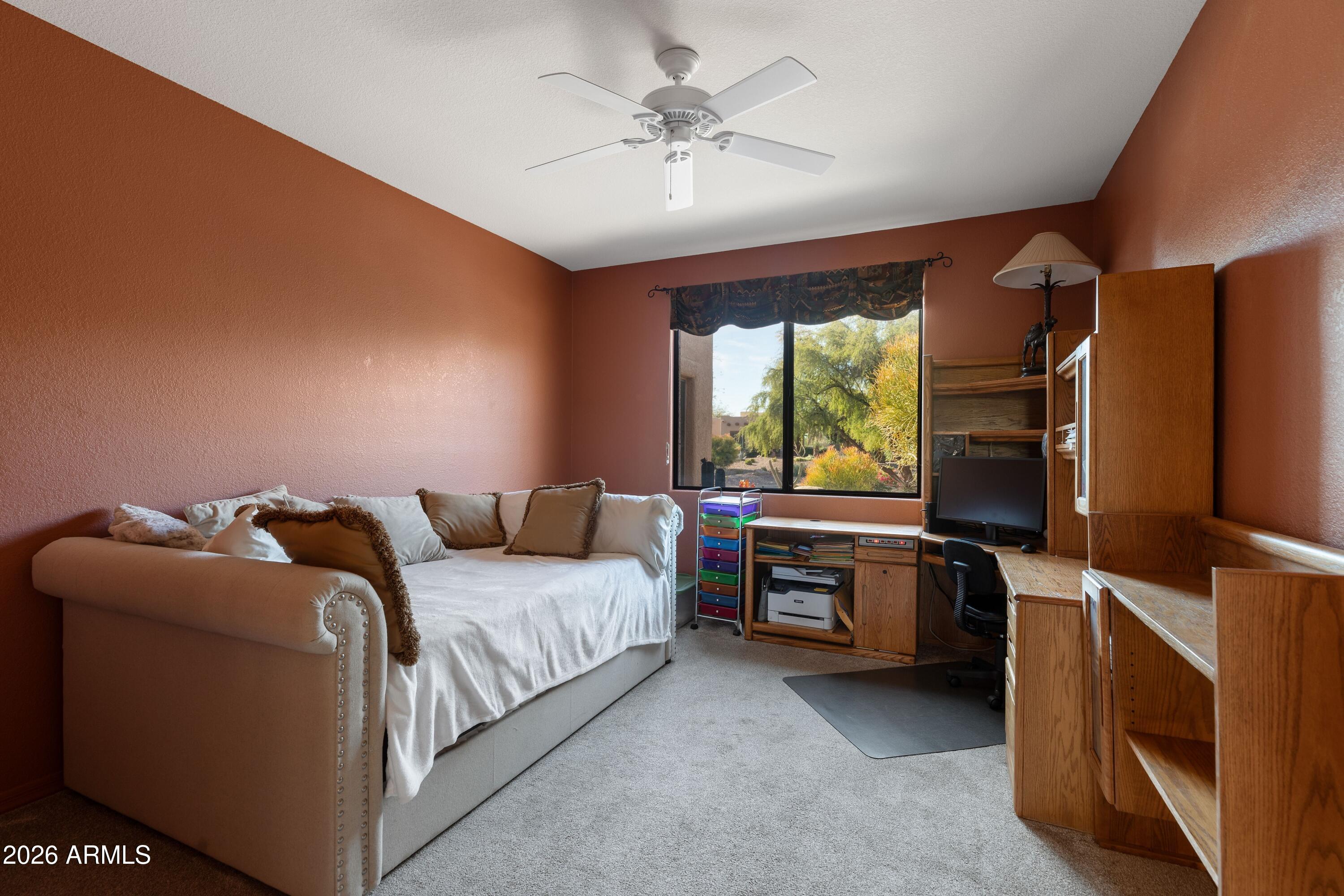 18622 North Tonto Verde Drive Rio Verde, AZ 85263 - Photo 24 of 47 a bedroom with a bed and a flat tv screen on dresser