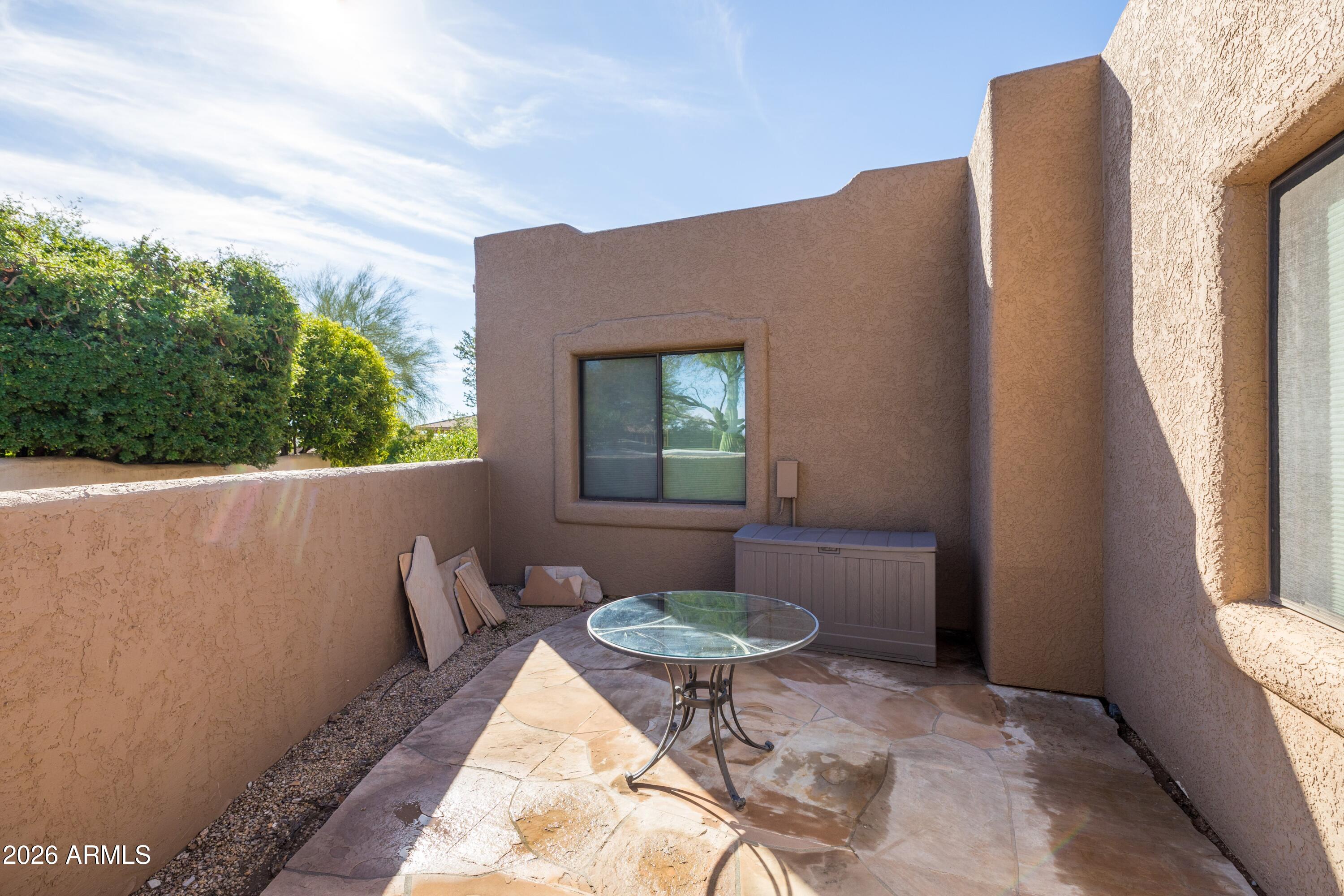 18622 North Tonto Verde Drive Rio Verde, AZ 85263 - Photo 35 of 47 a balcony with table and chairs