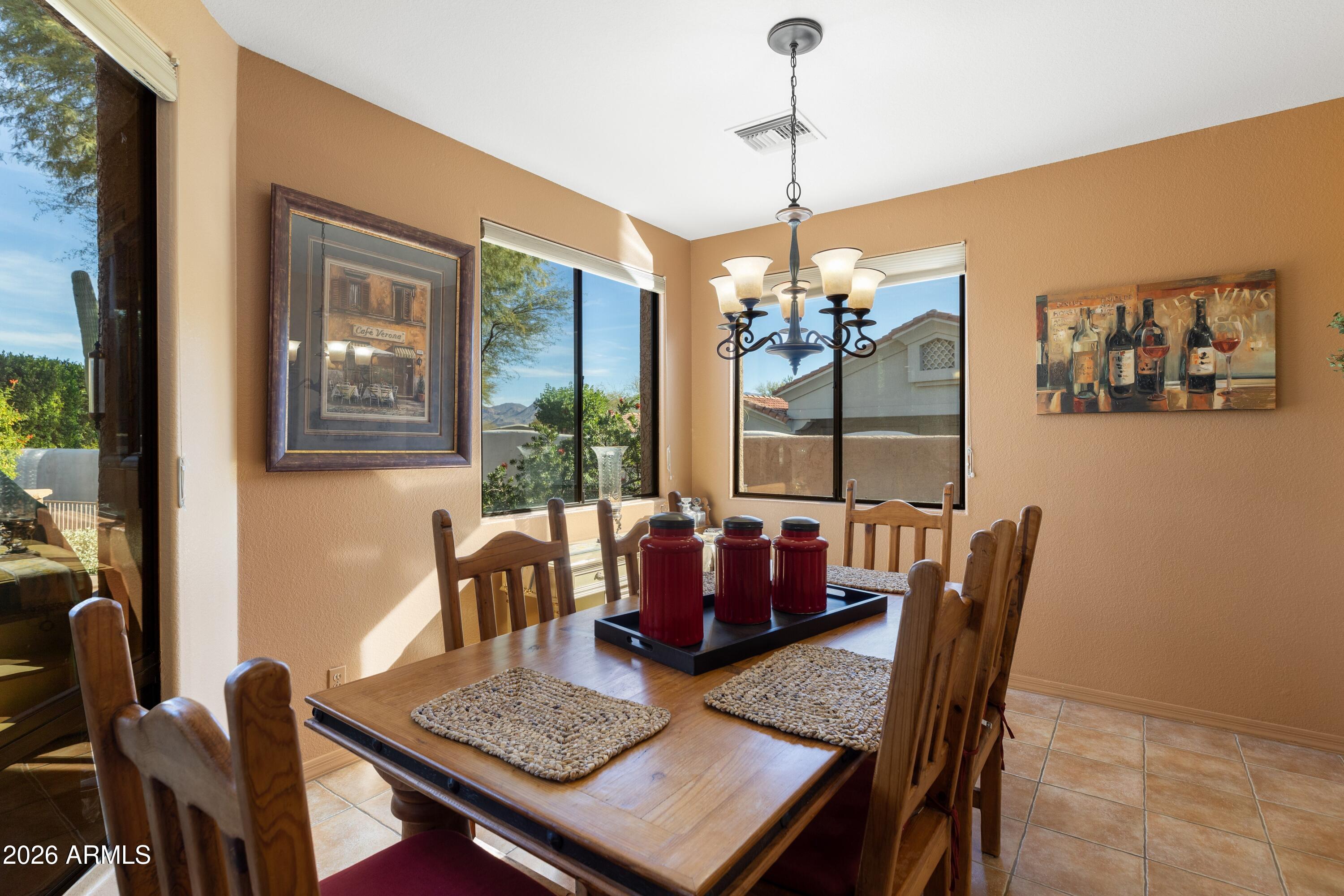 18622 North Tonto Verde Drive Rio Verde, AZ 85263 - Photo 5 of 47 a view of a dining room with furniture window and outside view