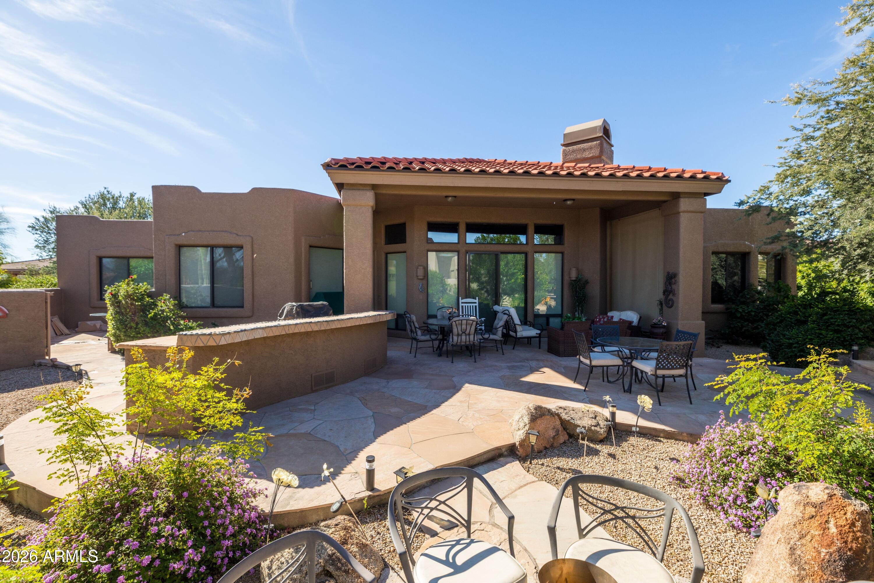 18622 North Tonto Verde Drive Rio Verde, AZ 85263 - Photo 9 of 47 a view of a patio with couches table and chairs and potted plants
