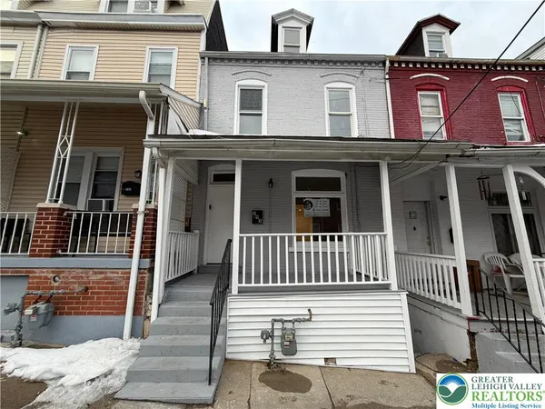 a view of a brick building with many windows