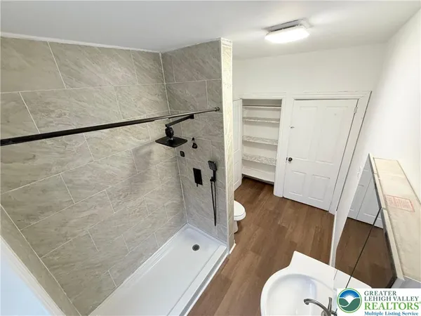 a bathroom with a tub and a shower