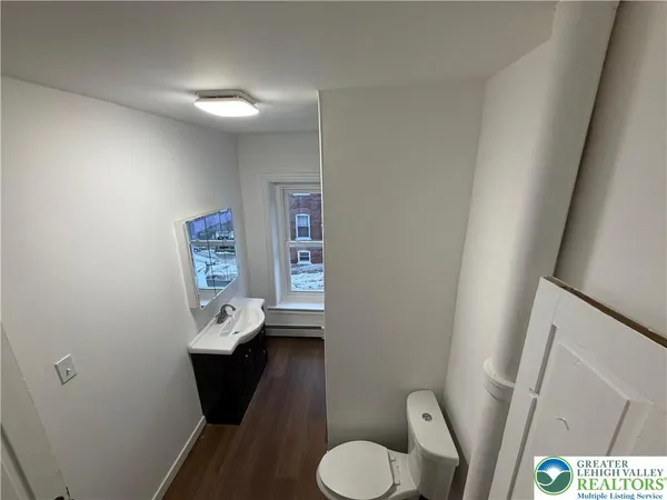 a bathroom with a toilet and a sink
