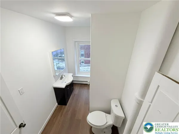 a bathroom with a toilet a sink and a bathtub