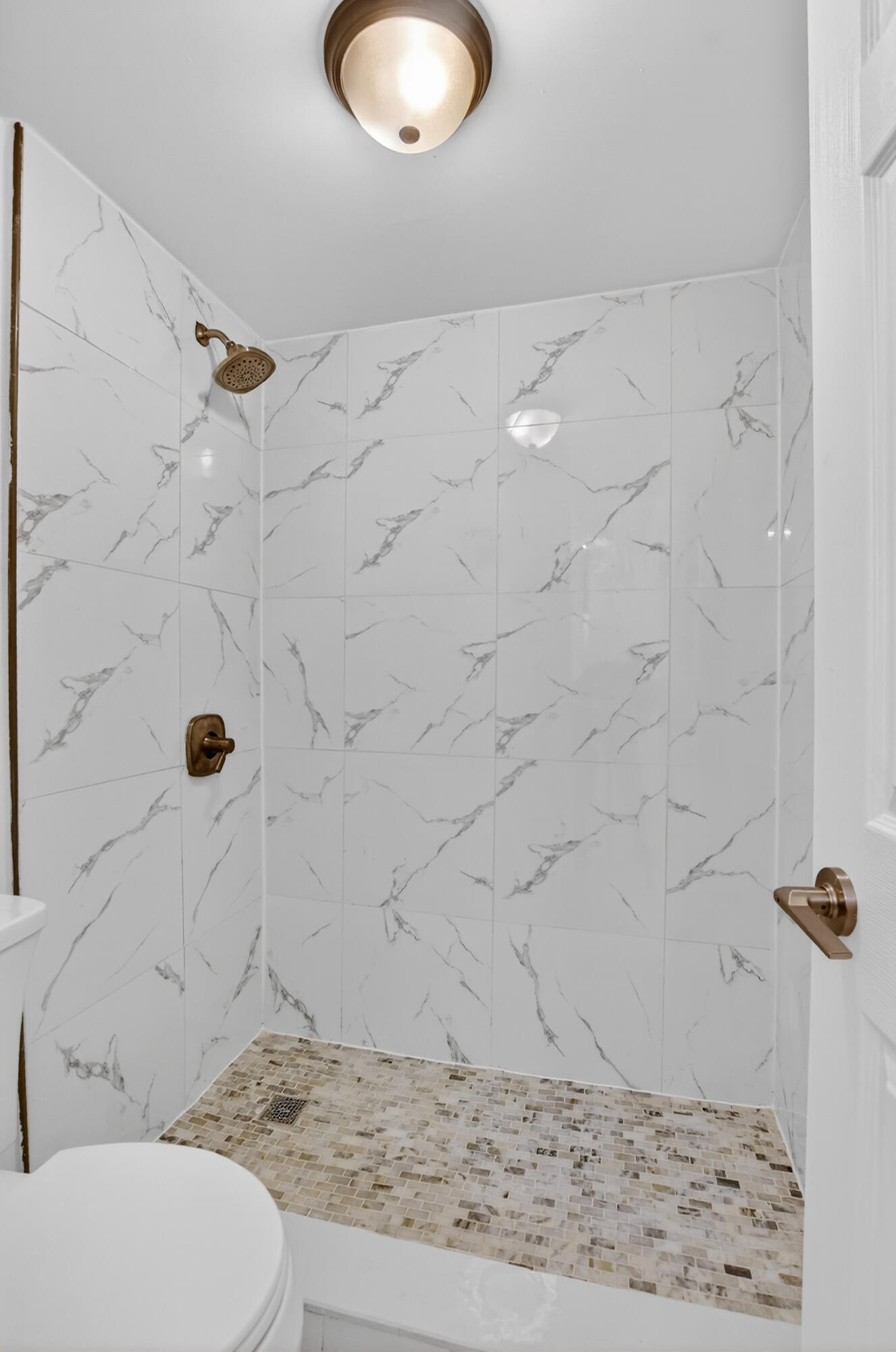 636 Northwest 13th Street, Unit 110 Boca Raton, FL 33486 - Photo 16 of 35 a bathroom with a granite countertop sink a toilet and shower