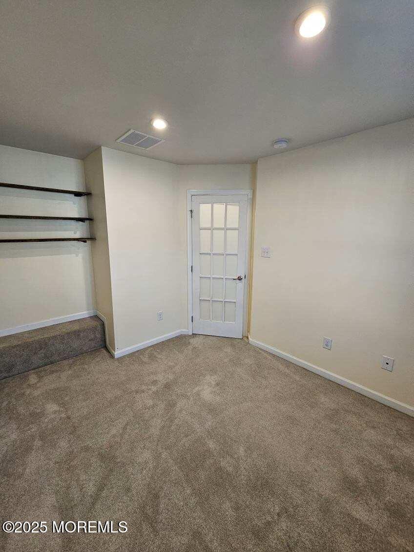 802 Rio Grande Drive, Unit 2002 Toms River, NJ 08755 - Photo 18 of 41 an empty room with a empty space and windows