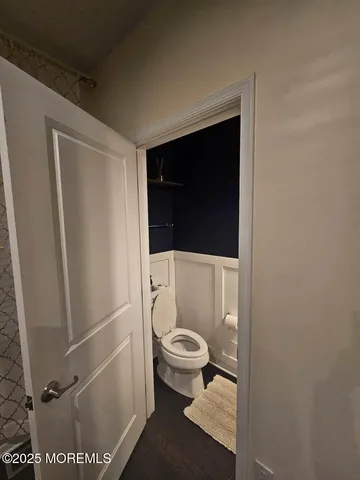 a view of room with wooden floor and chair