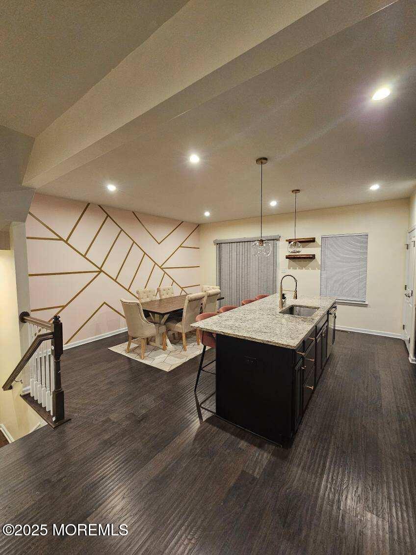 802 Rio Grande Drive, Unit 2002 Toms River, NJ 08755 - Photo 3 of 41 a kitchen with a sink and wooden floor