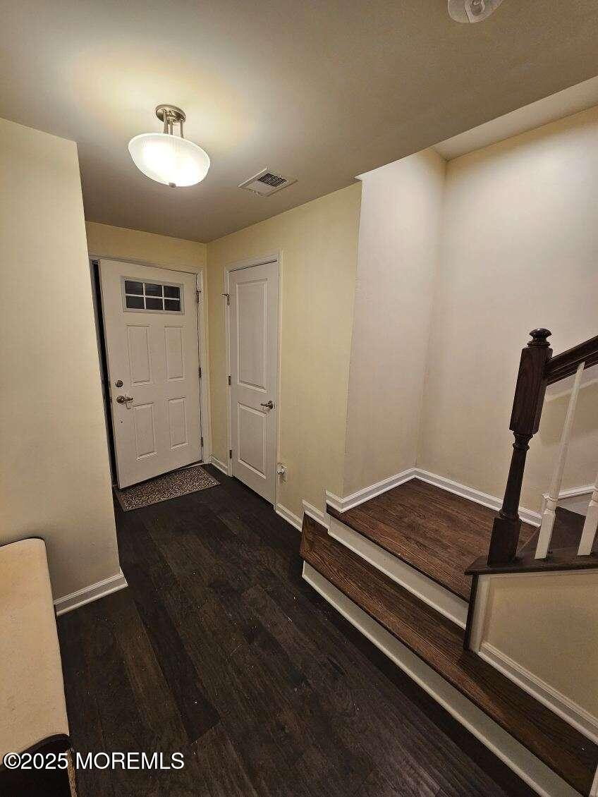 802 Rio Grande Drive, Unit 2002 Toms River, NJ 08755 - Photo 31 of 41 a view of room with wooden floor and chair