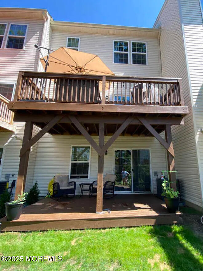 802 Rio Grande Drive, Unit 2002 Toms River, NJ 08755 - Photo 40 of 41 a front view of a house with porch yard and outdoor seating
