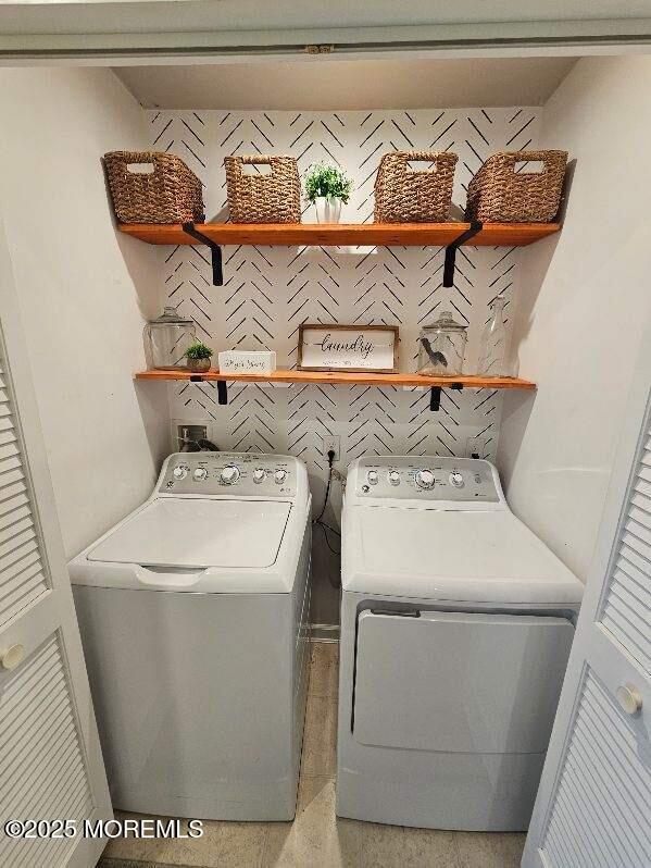 802 Rio Grande Drive, Unit 2002 Toms River, NJ 08755 - Photo 7 of 41 a utility room with dryer and washer