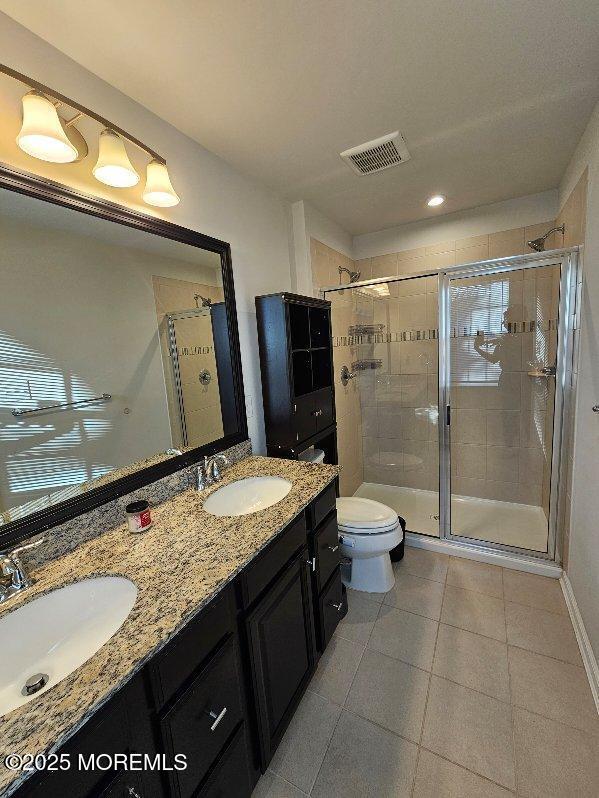 802 Rio Grande Drive, Unit 2002 Toms River, NJ 08755 - Photo 10 of 41 a bathroom with a granite countertop sink toilet mirror and shower
