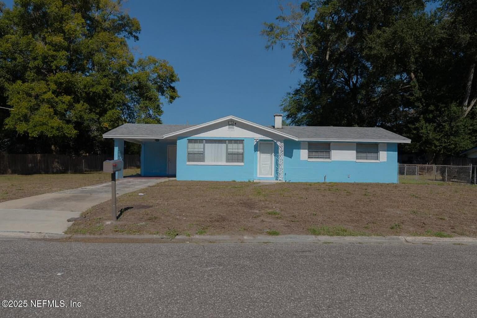 a house with trees in the background