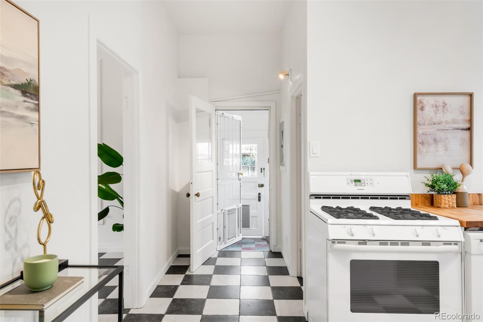 3905 Tejon Street Denver, CO 80211 - Photo 13 of 47 a view of a kitchen with a stove top oven