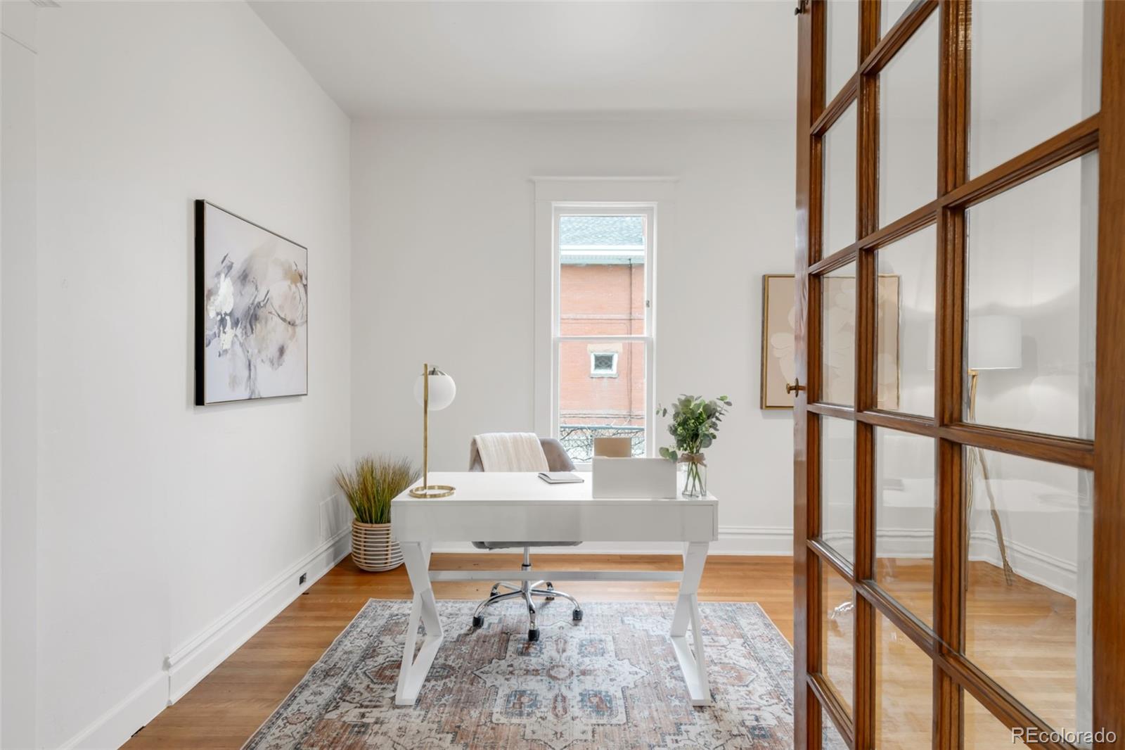3905 Tejon Street Denver, CO 80211 - Photo 17 of 47 a bed room with a bed and a window