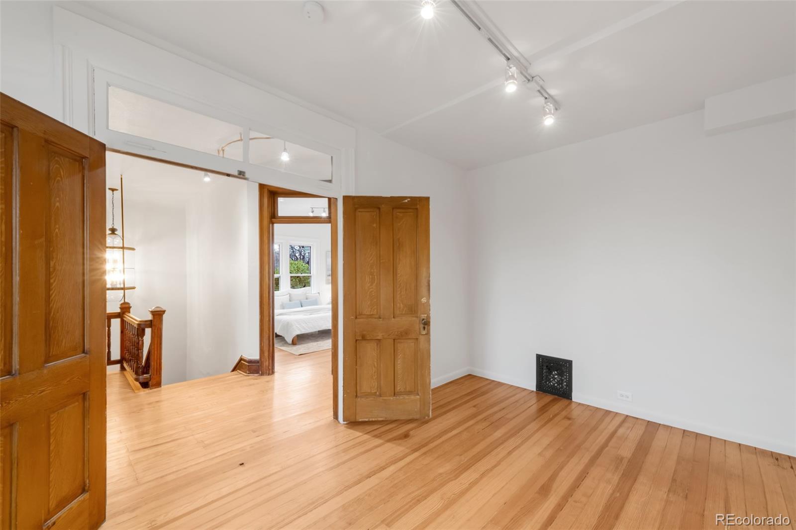3905 Tejon Street Denver, CO 80211 - Photo 30 of 47 a view of empty room with wooden floor
