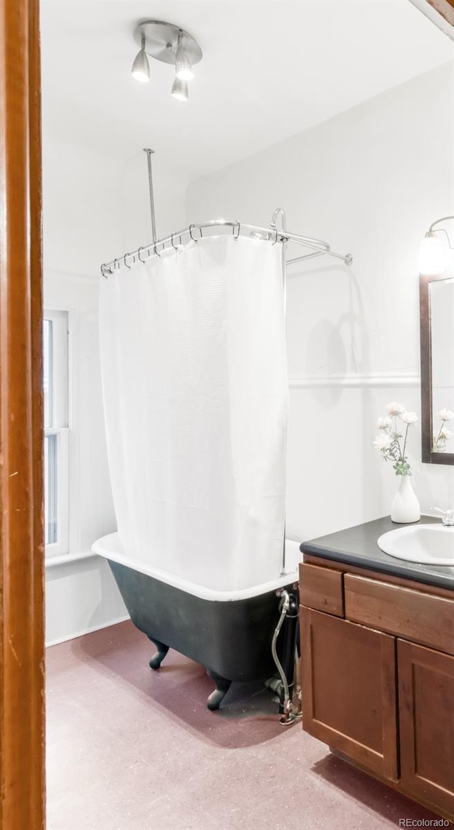 3905 Tejon Street Denver, CO 80211 - Photo 33 of 47 a room with a sink and a mirror