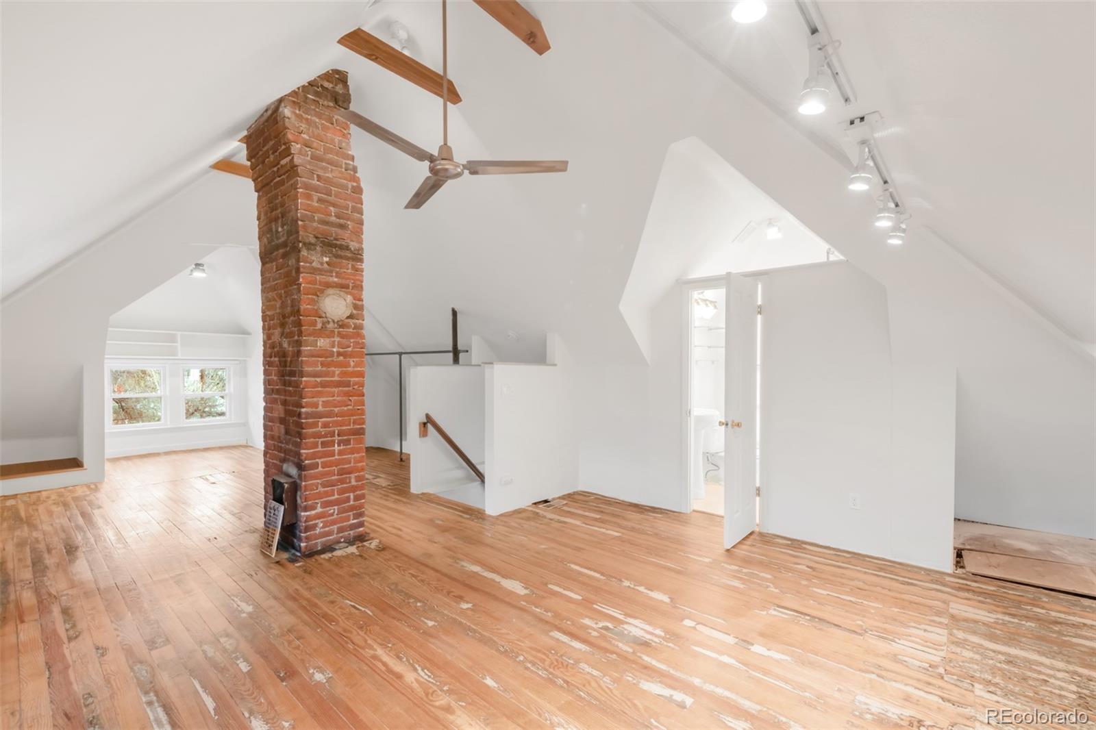 3905 Tejon Street Denver, CO 80211 - Photo 36 of 47 a view of a room with stairs and wooden floor