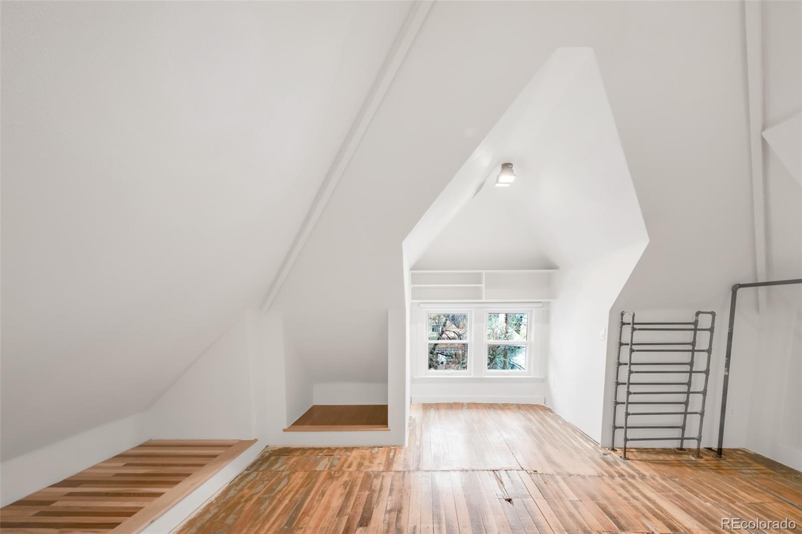 3905 Tejon Street Denver, CO 80211 - Photo 39 of 47 wooden floor in an empty room with a window